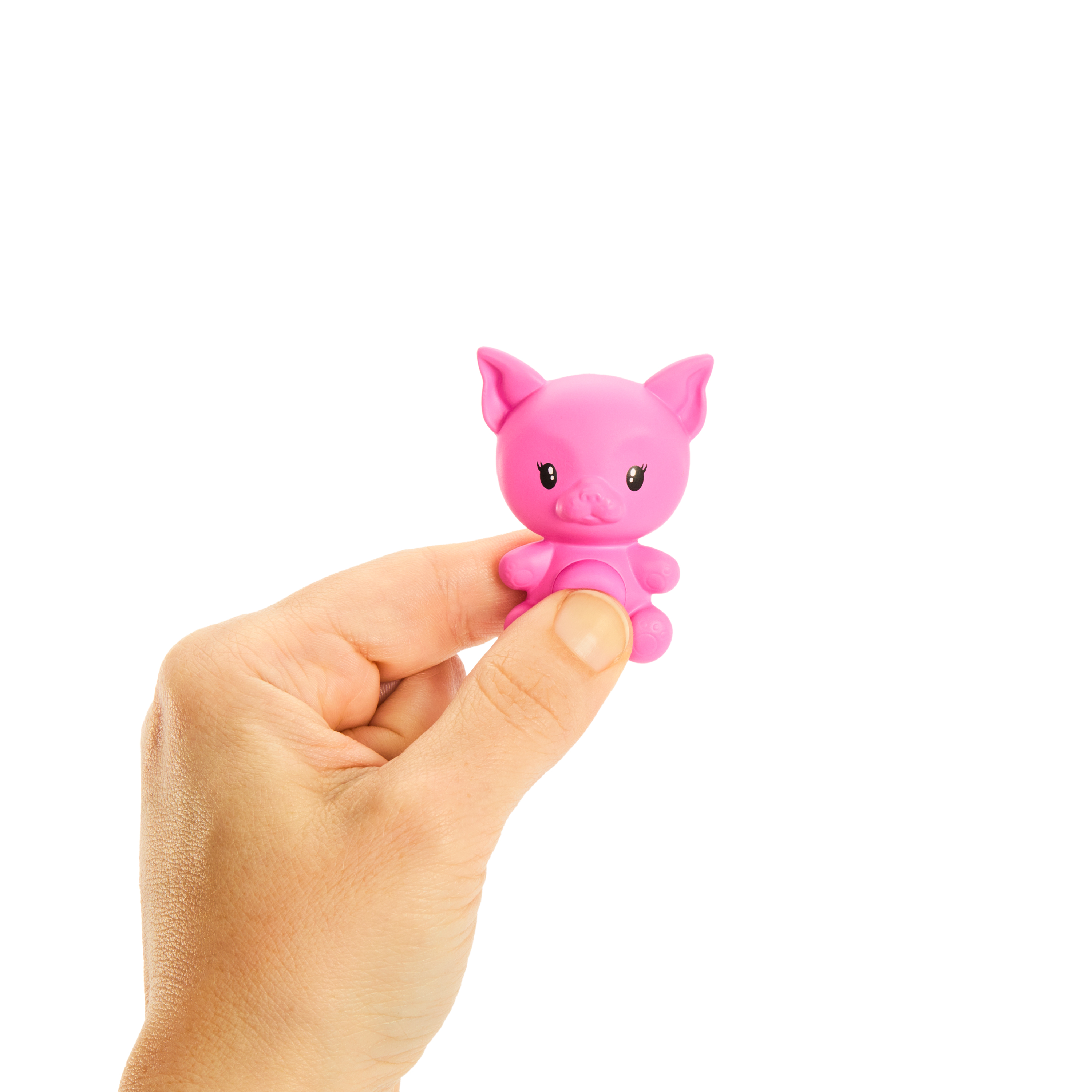 Eine Hand hält ein kleines rosa Spielzeugschwein. Das Schwein lächelt und hat kleine schwarze Augen.
