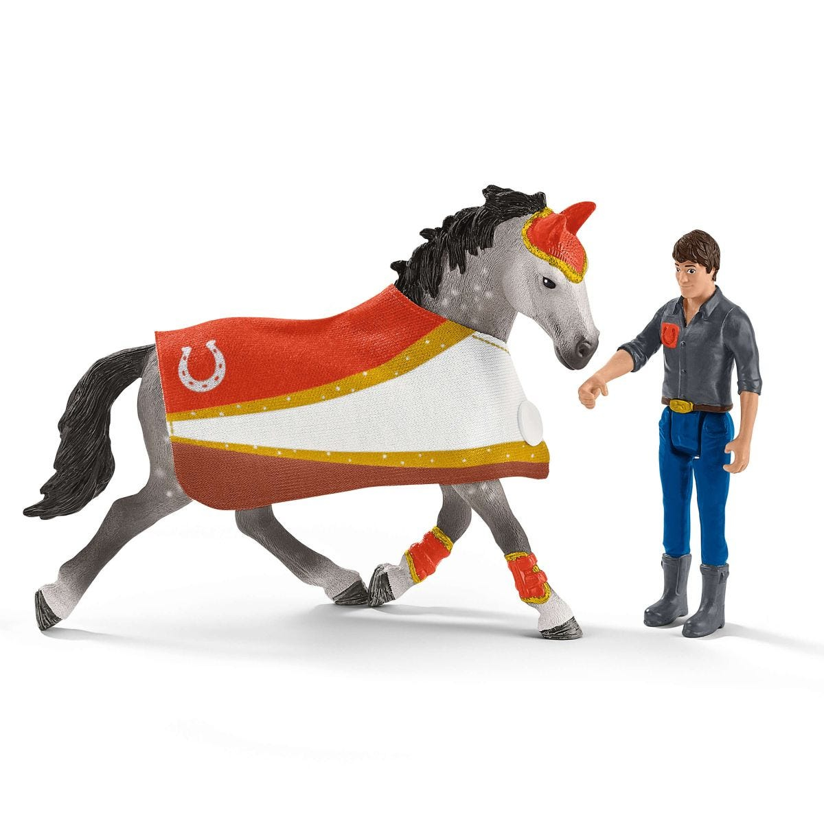 Spielzeugpferd mit Reiterfigur. Das Pferd ist grau und der Reiter trägt blaue Hose.