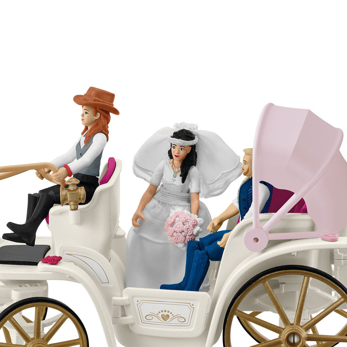 Toy figures in a white carriage. A woman drives. A bride, groom, and carriage are visible.