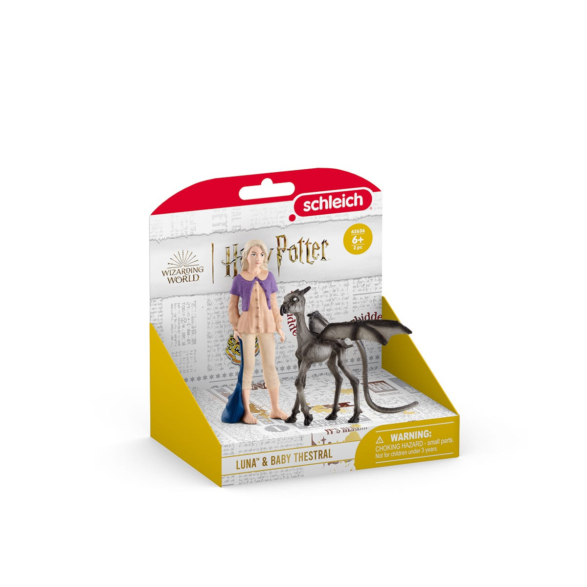 Una figura di Luna Lovegood e un baby Thestral in una scatola espositiva di Harry Potter.