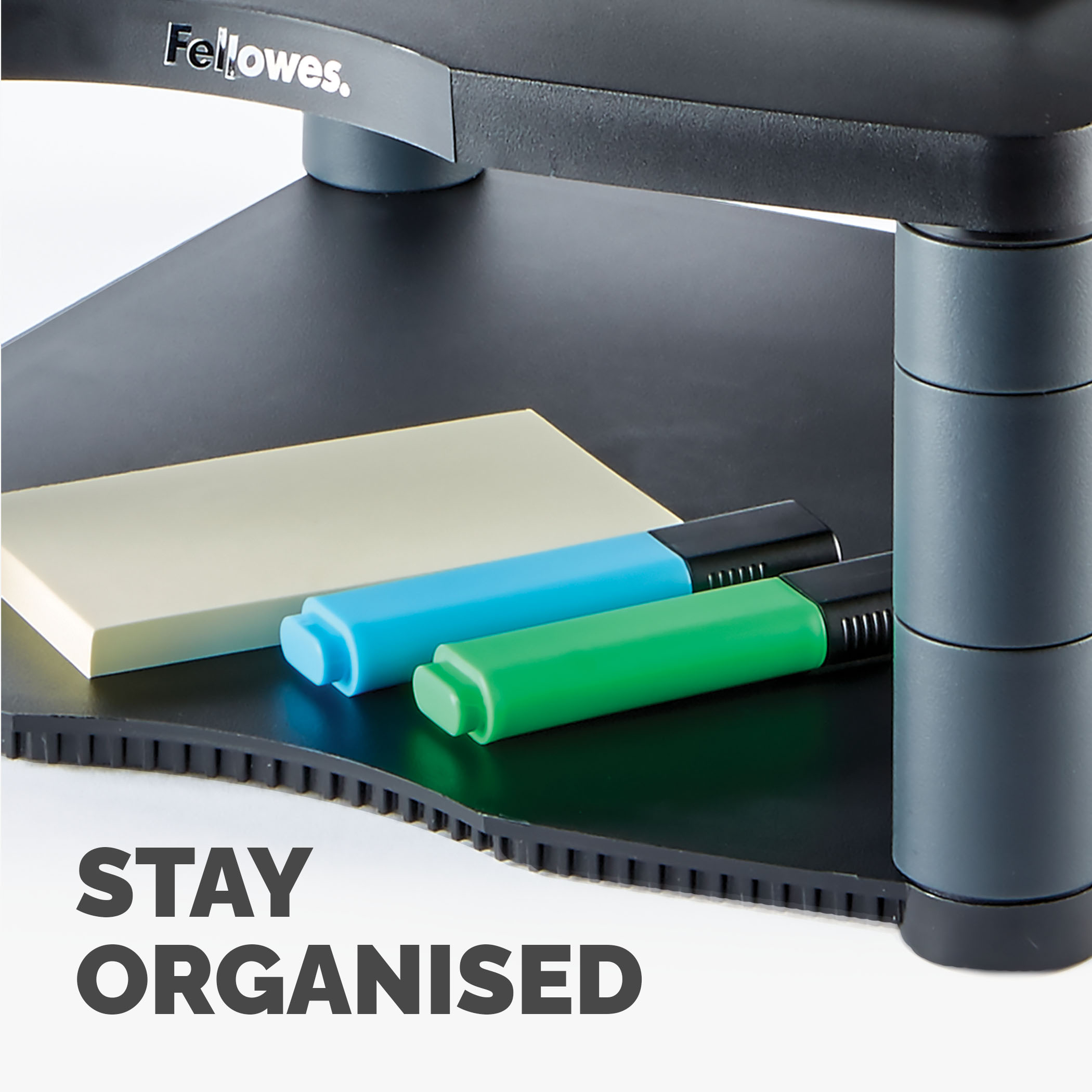 Czarny organizer biurkowy z kolorowymi markerami i karteczkami samoprzylepnymi, tekst 'STAY ORGANISED'.