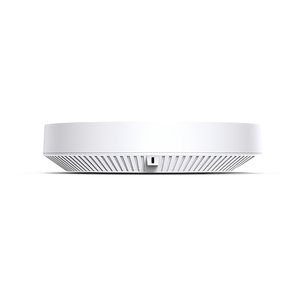 Appareil rond blanc, probablement un hub domotique, avec une grille en bas.