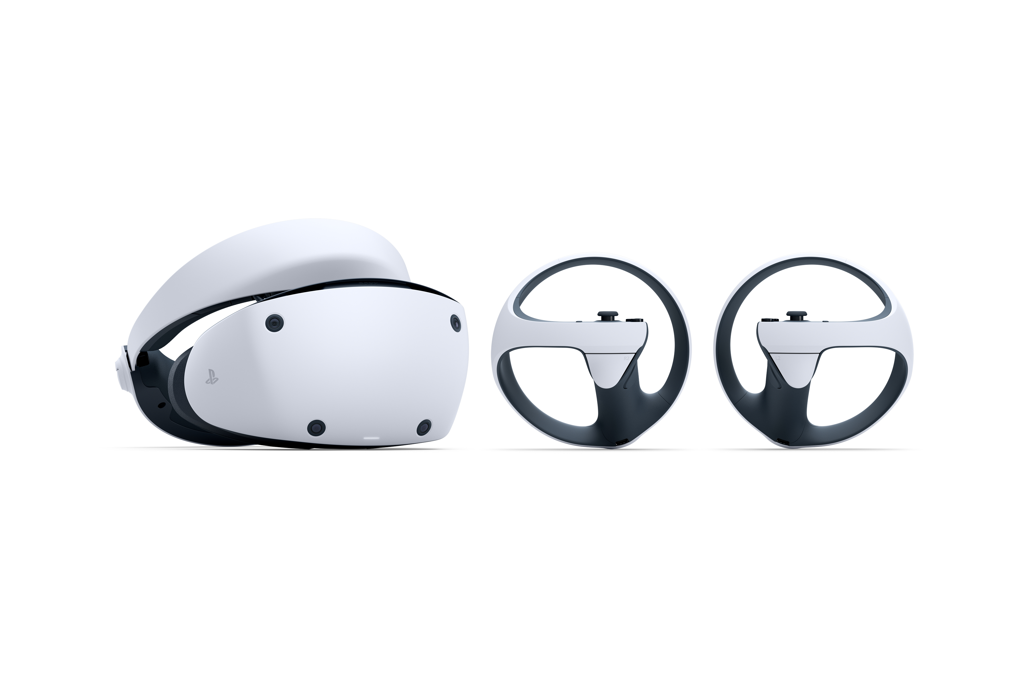 Ein weißes VR-Headset und zwei Controller. Sie befinden sich auf einer weißen Oberfläche, einsatzbereit.