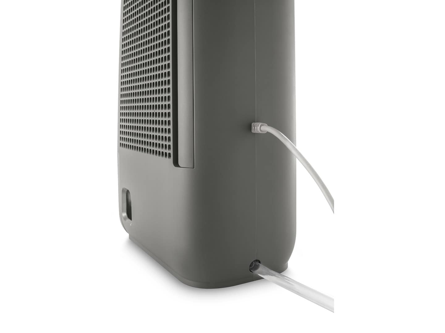 Zbliżenie szarego osuszacza powietrza, pokazujące stronę z wentylacją i wylotami wody.