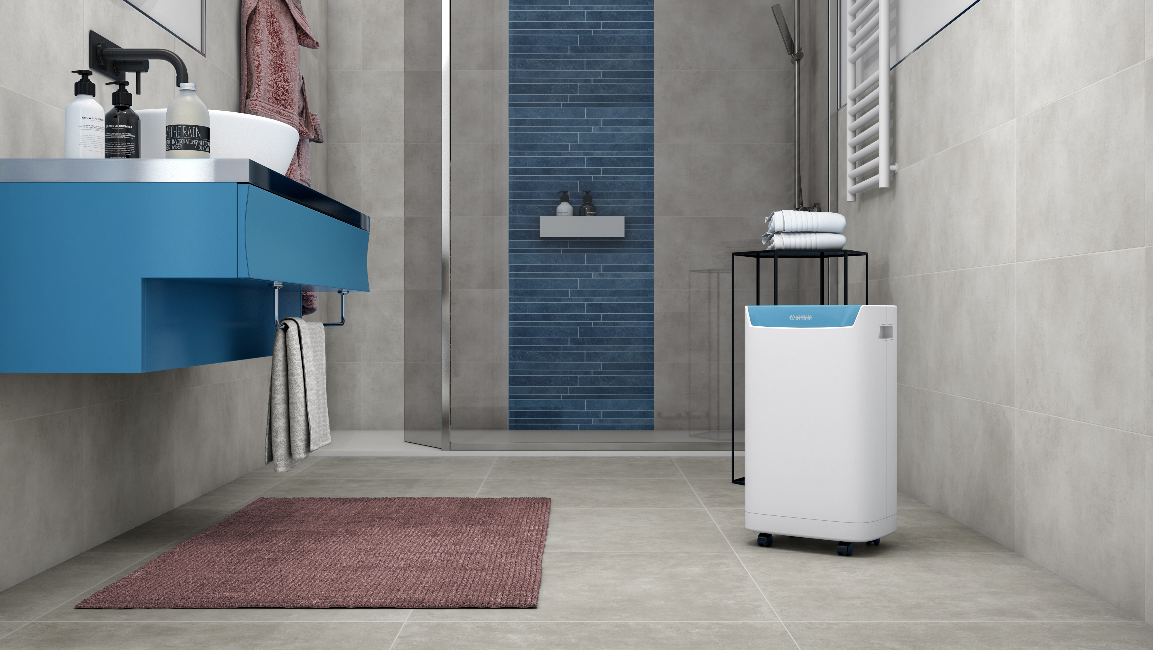 Łazienka z niebieską szafką, lustrem i białym oczyszczaczem powietrza.