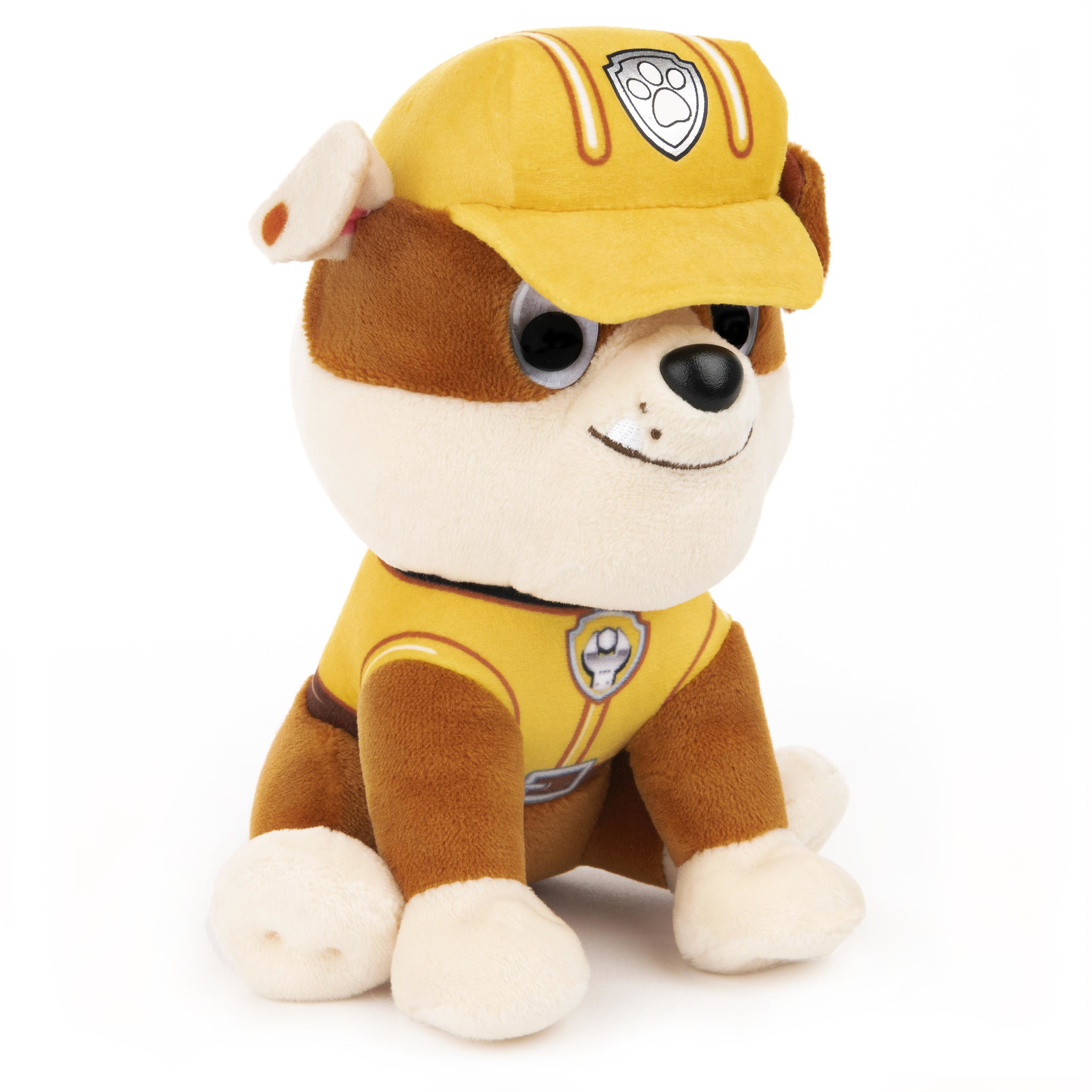 Ein Plüschtier von Rubble aus Paw Patrol, mit gelbem Bauarbeiterhut und Weste.