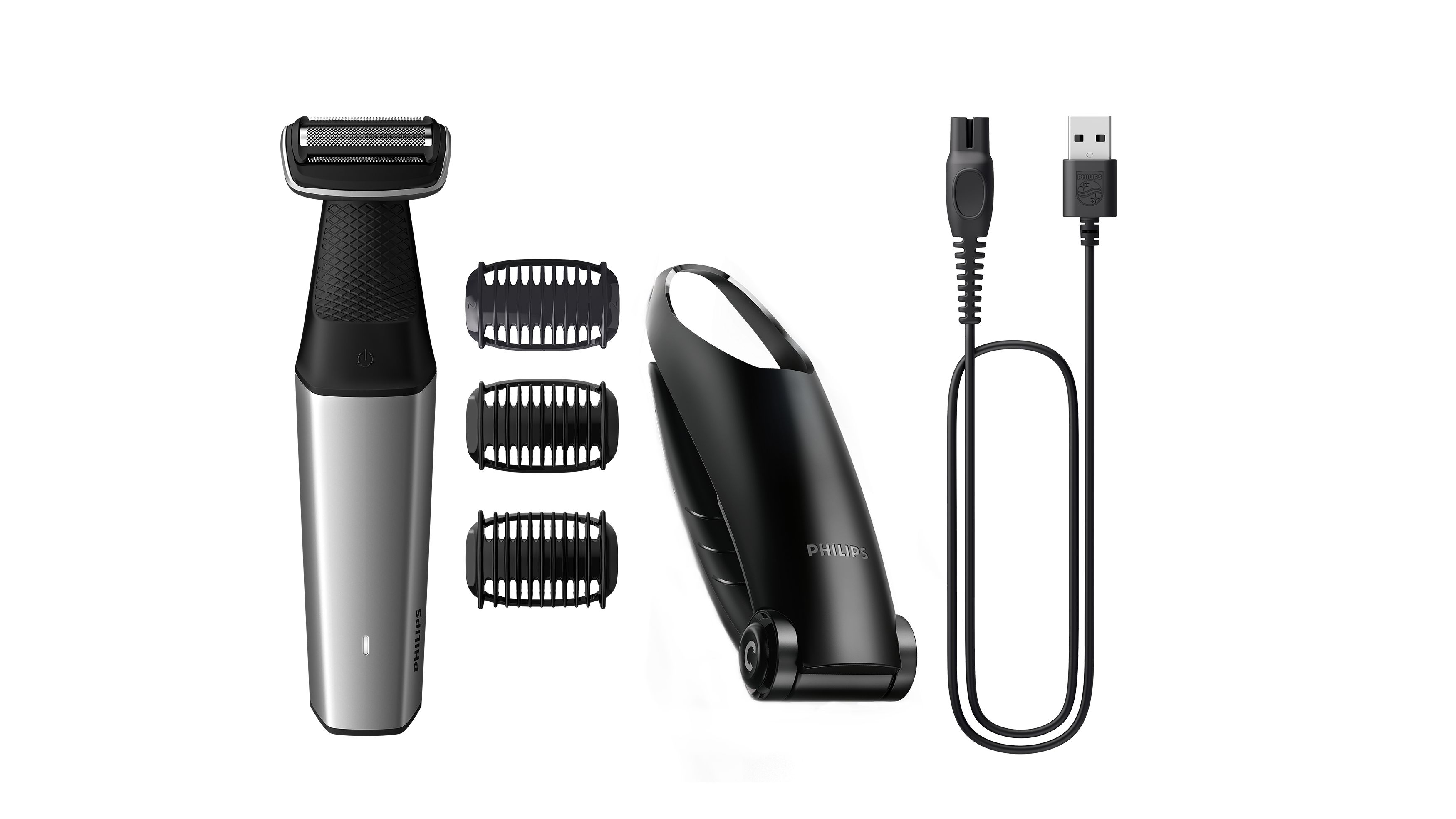 Tres recortadoras Philips Bodygroom y un cable de carga USB. Colores negro y plateado.