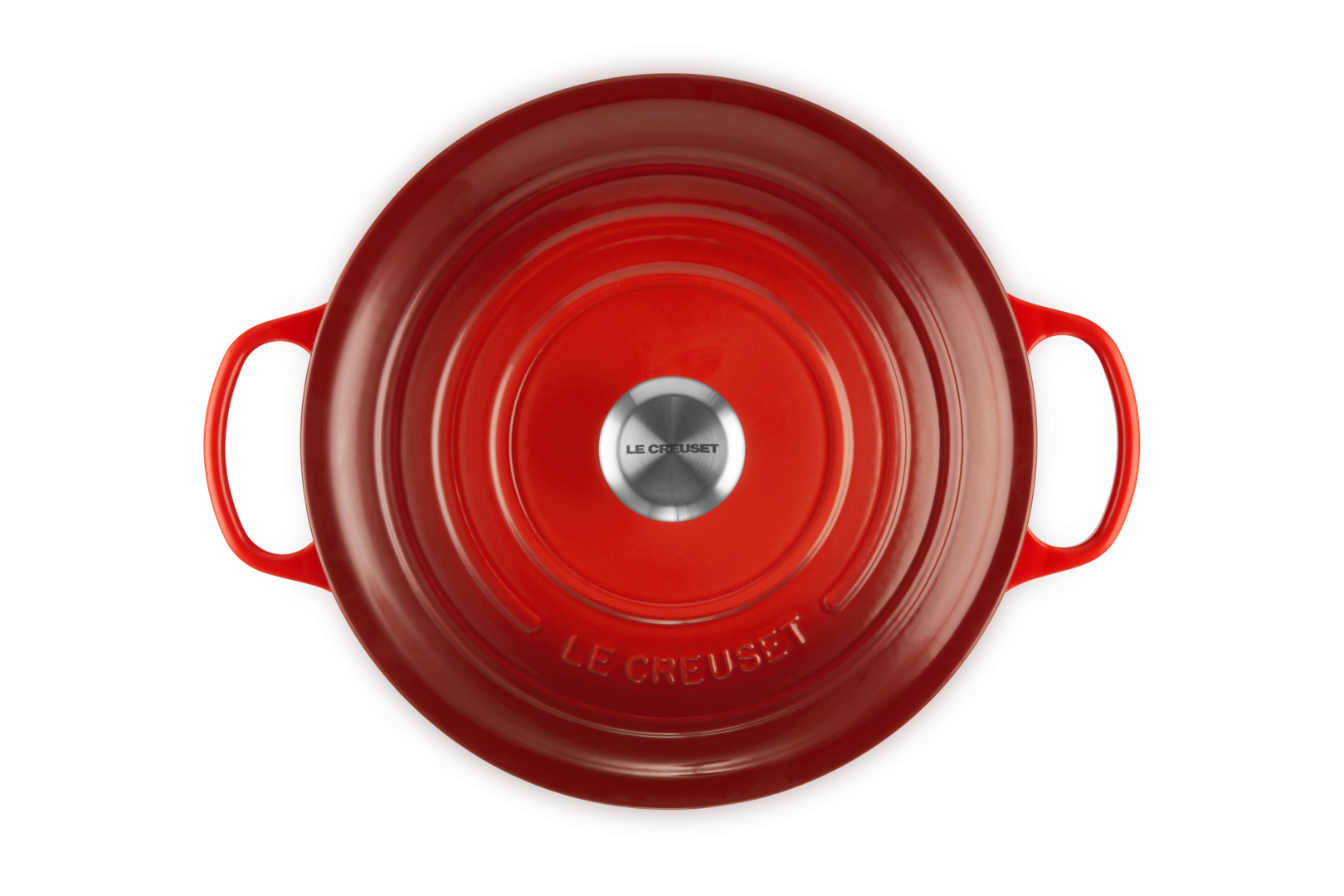 Runder roter Le Creuset Bräter, Draufsicht auf weißem Hintergrund.