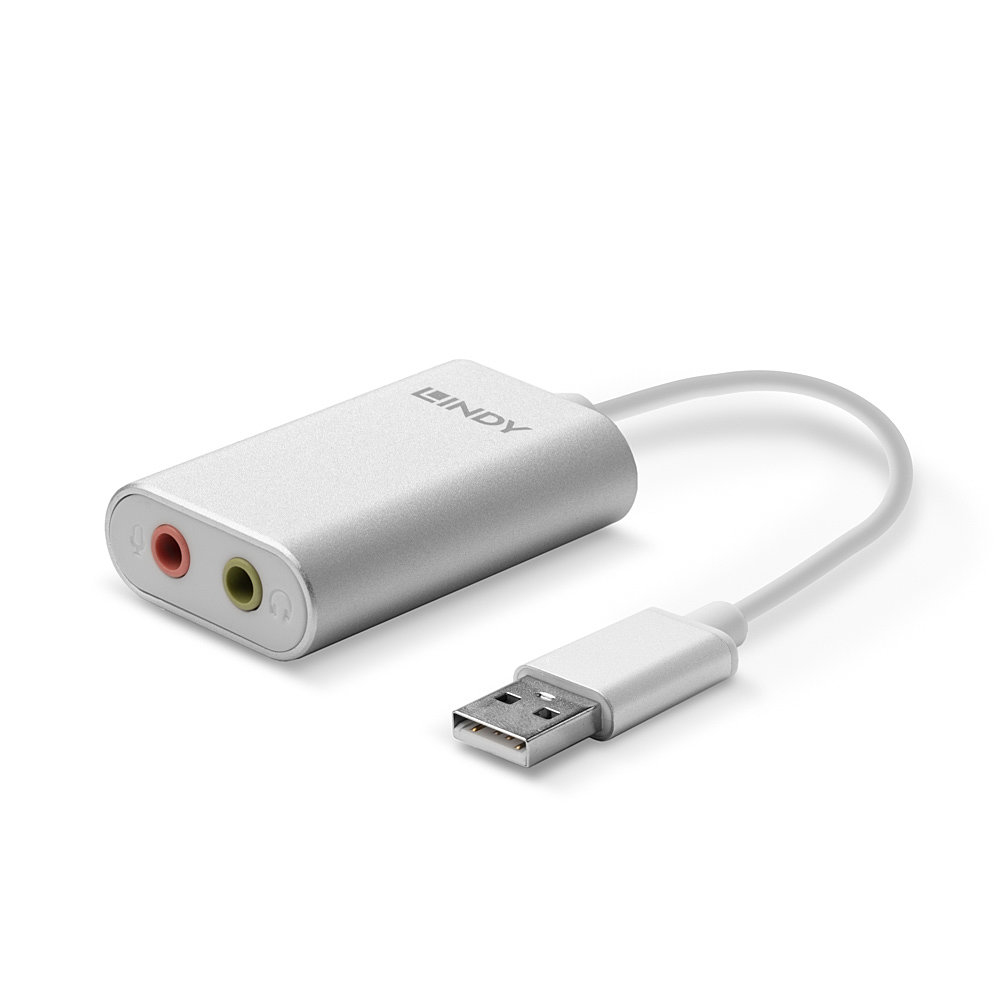 Ein silberner Adapter mit Audioanschlüssen und einem USB-Anschluss für einen Computer oder ein Gerät.