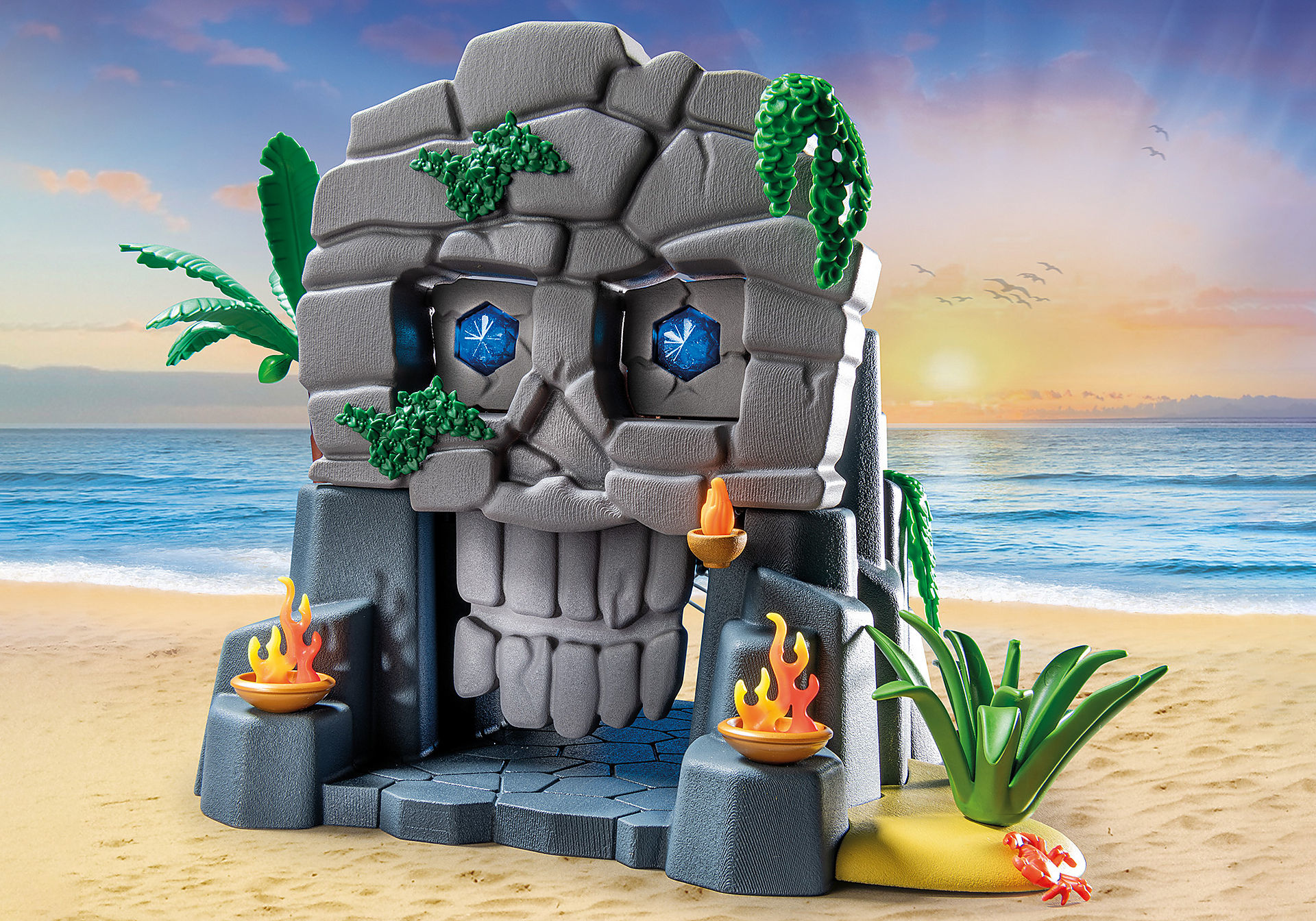 Playmobil-Spielset eines Steinschädels am Strand mit Feuertoren.