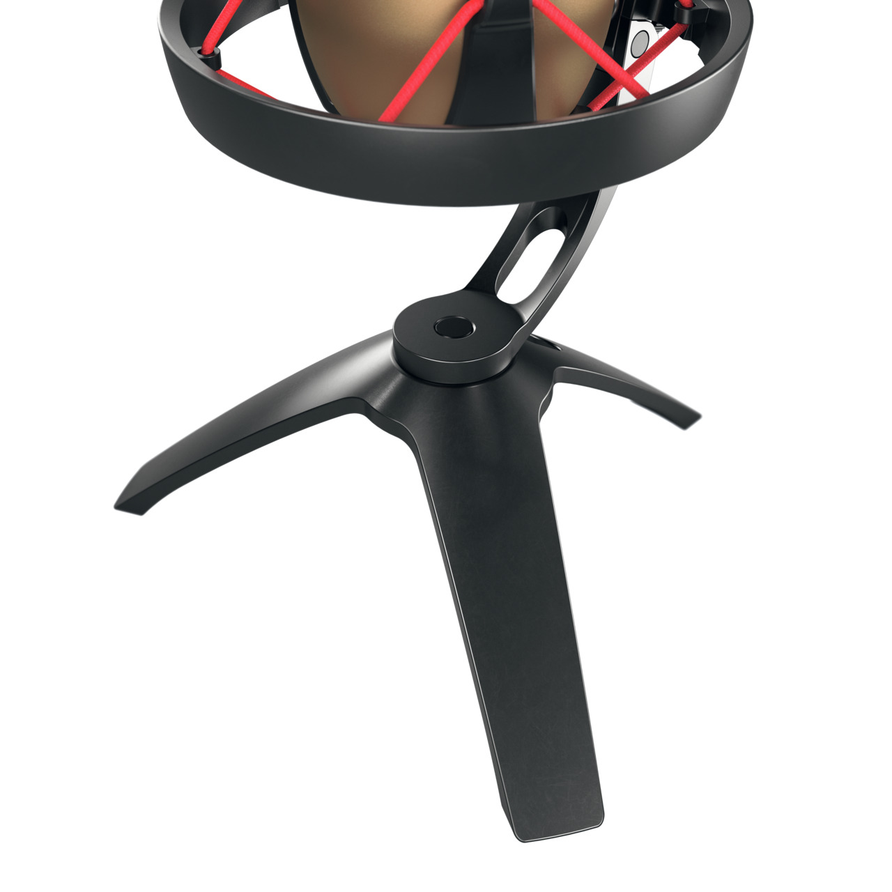 Black microphone on a tripod stand with red mesh. White background.