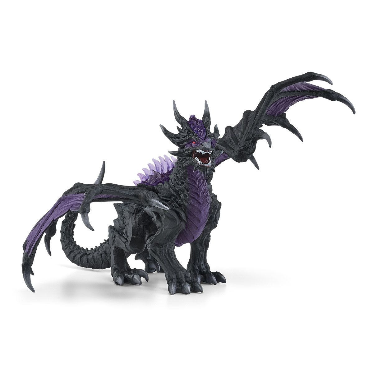 Un giocattolo a forma di drago nero e viola, in piedi su uno sfondo bianco.