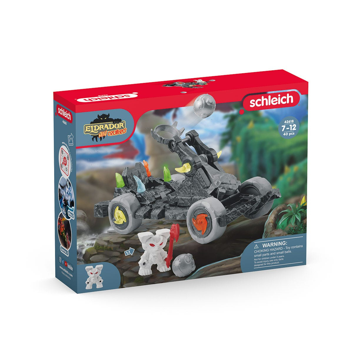 Una scatola di giocattoli con un monster truck grigio e figure di dinosauri. La scatola è rossa, nera e bianca.