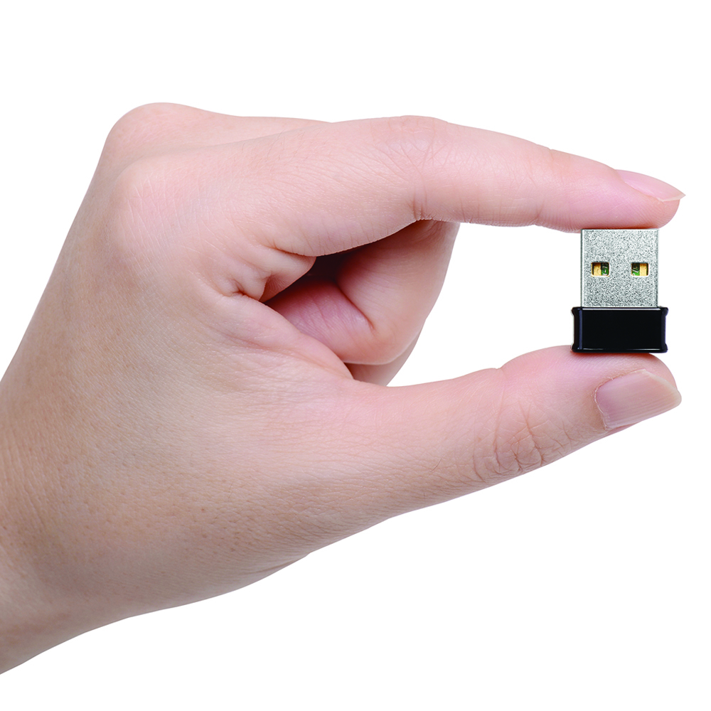A hand holding a small, silver USB drive with a black base, against a white background.