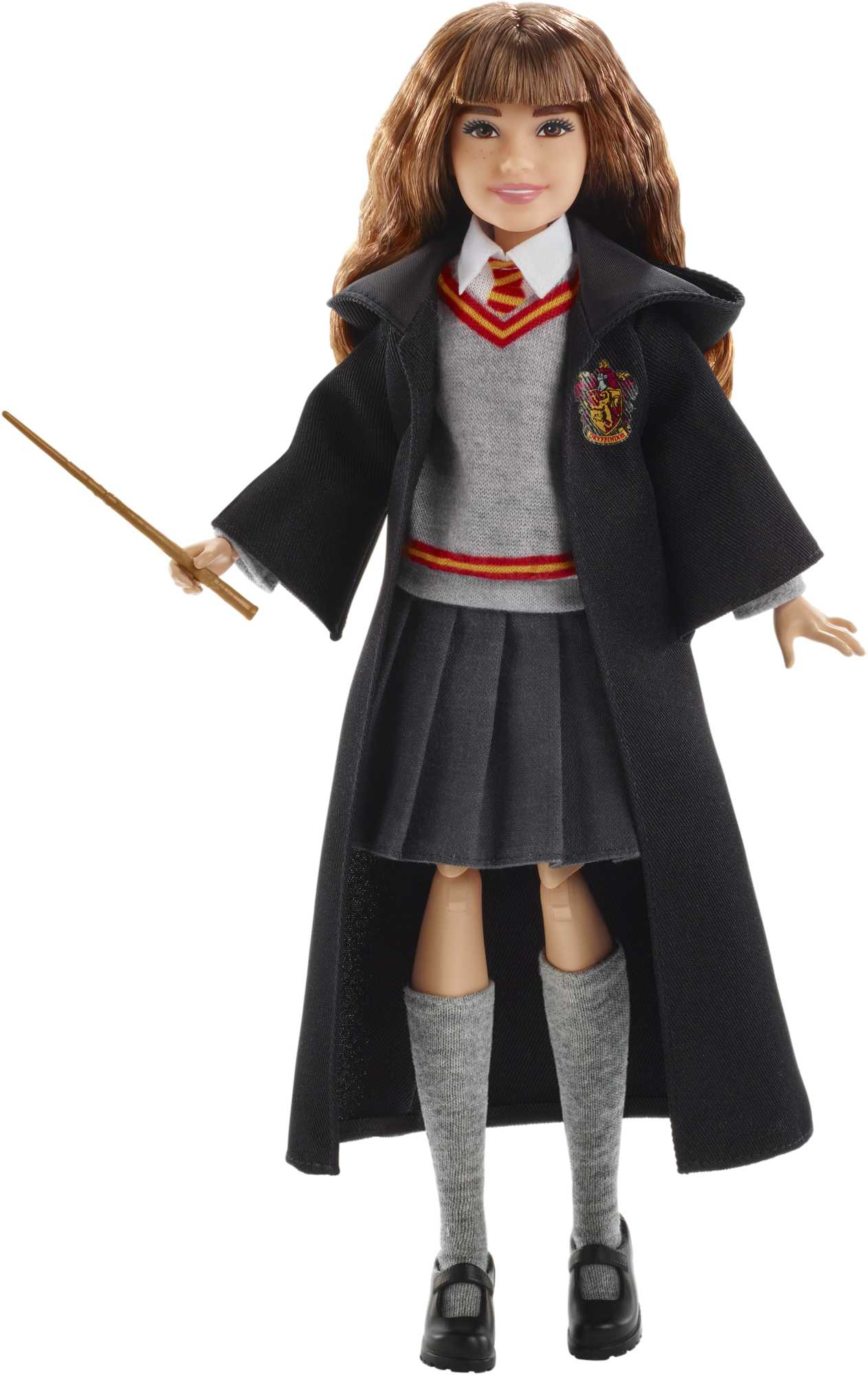Puppe eines Mädchens in Hogwarts-Uniform, mit Zauberstab. Weißer Hintergrund.