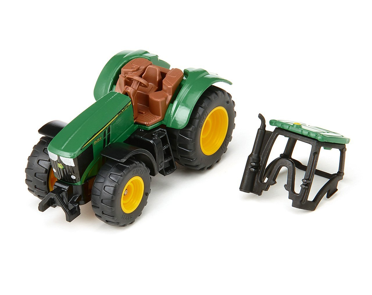 Ein grüner und gelber Spielzeugtraktor mit einem separaten schwarzen Rahmen auf weißem Grund.
