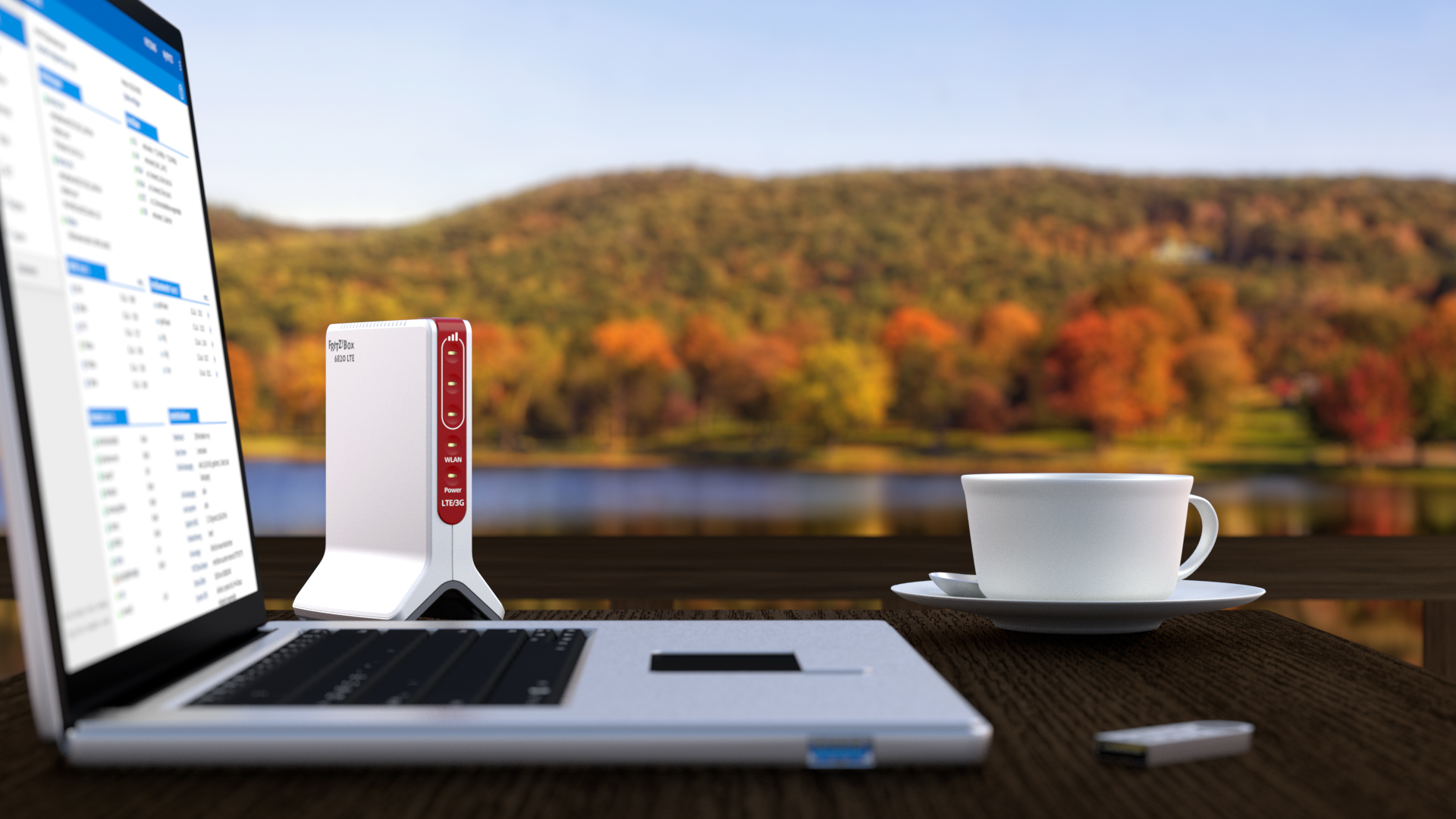 Laptop z routerem i filiżanką kawy na drewnianym stole, z malowniczym tłem.