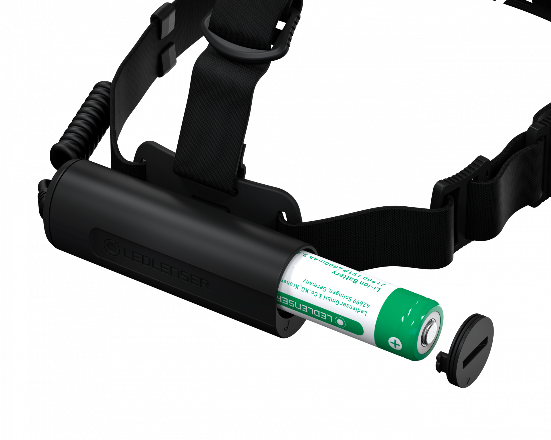 Czarna latarka czołowa z otwartym komorą baterii. Widać zieloną baterię.