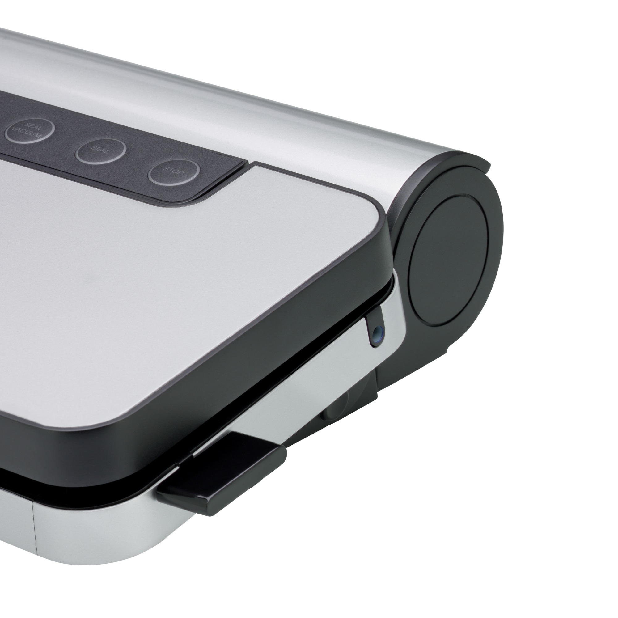 Zbliżenie srebrno-czarnej zgrzewarki próżniowej z przyciskami oznaczonymi jako 'Seal', 'Vacuum' i 'Stop'.
