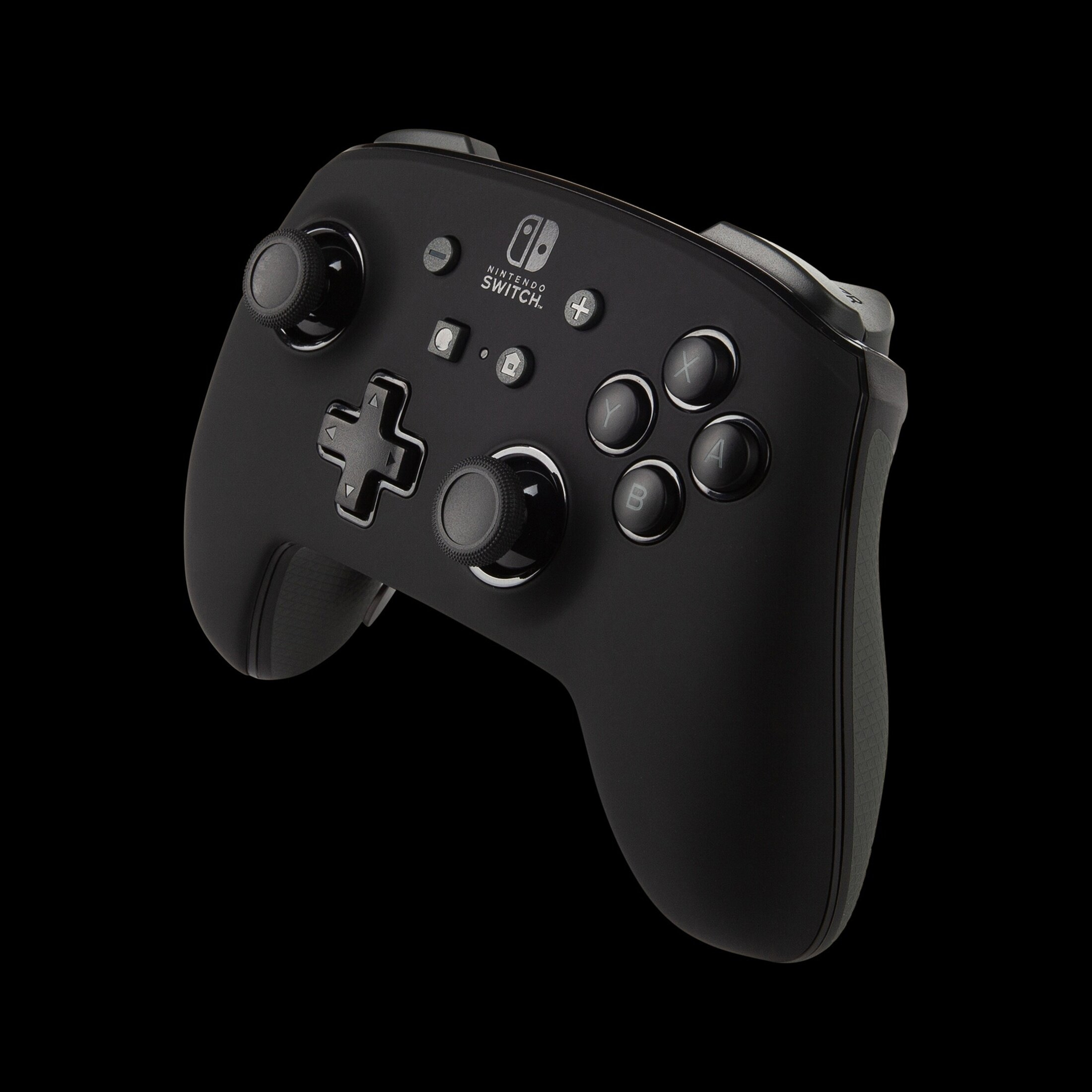 Black Nintendo Switch Pro controller with buttons and joysticks, on black background.