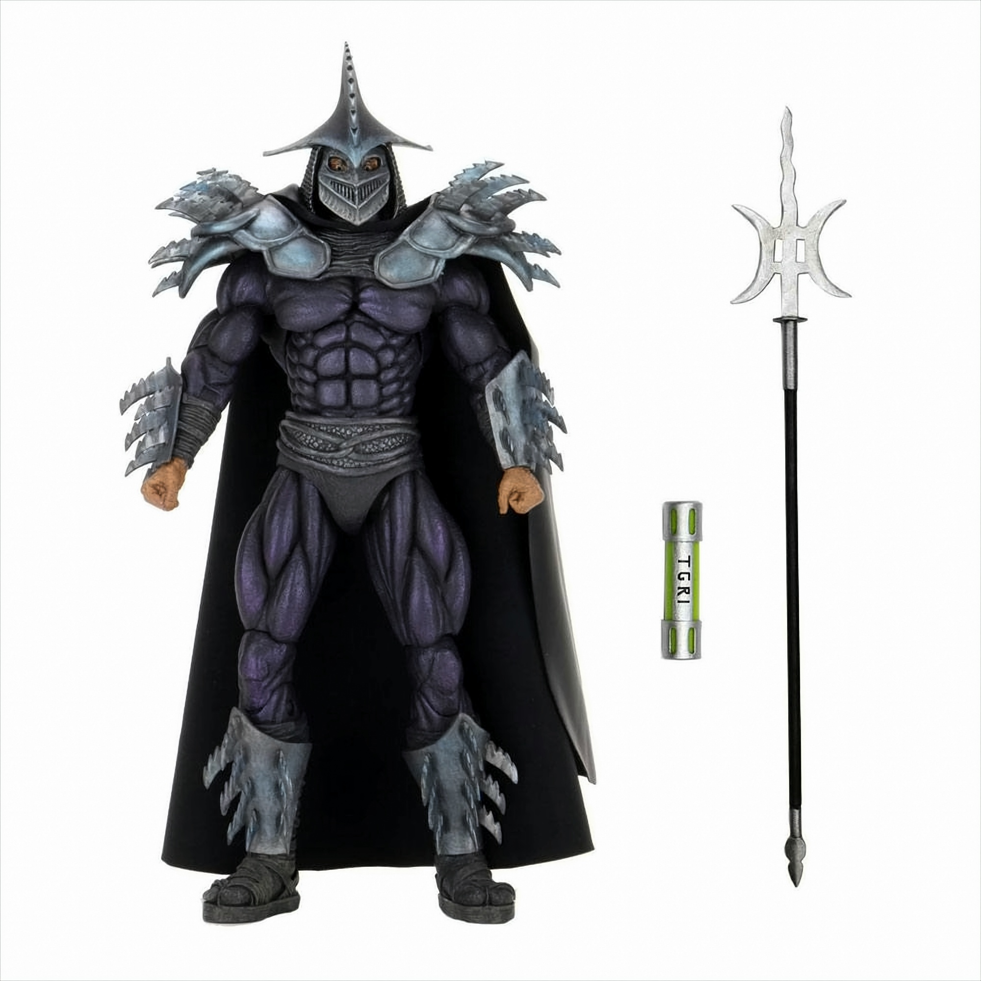 Shredder Actionfigur mit Waffe, Speer und kleinem grünen Behälter.