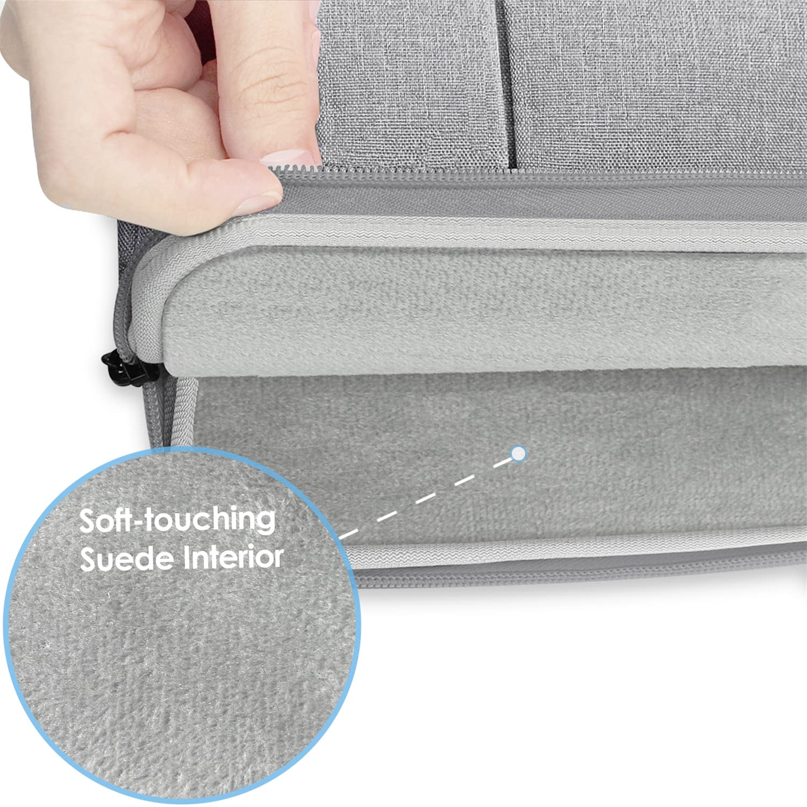 Nahaufnahme einer hellgrauen Laptoptasche, die Innenseite ist weiches Wildleder, ein Reißverschluss ist sichtbar.