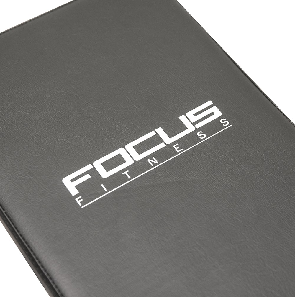 Black fitness mat with white "FOCUS FITNESS" logo.