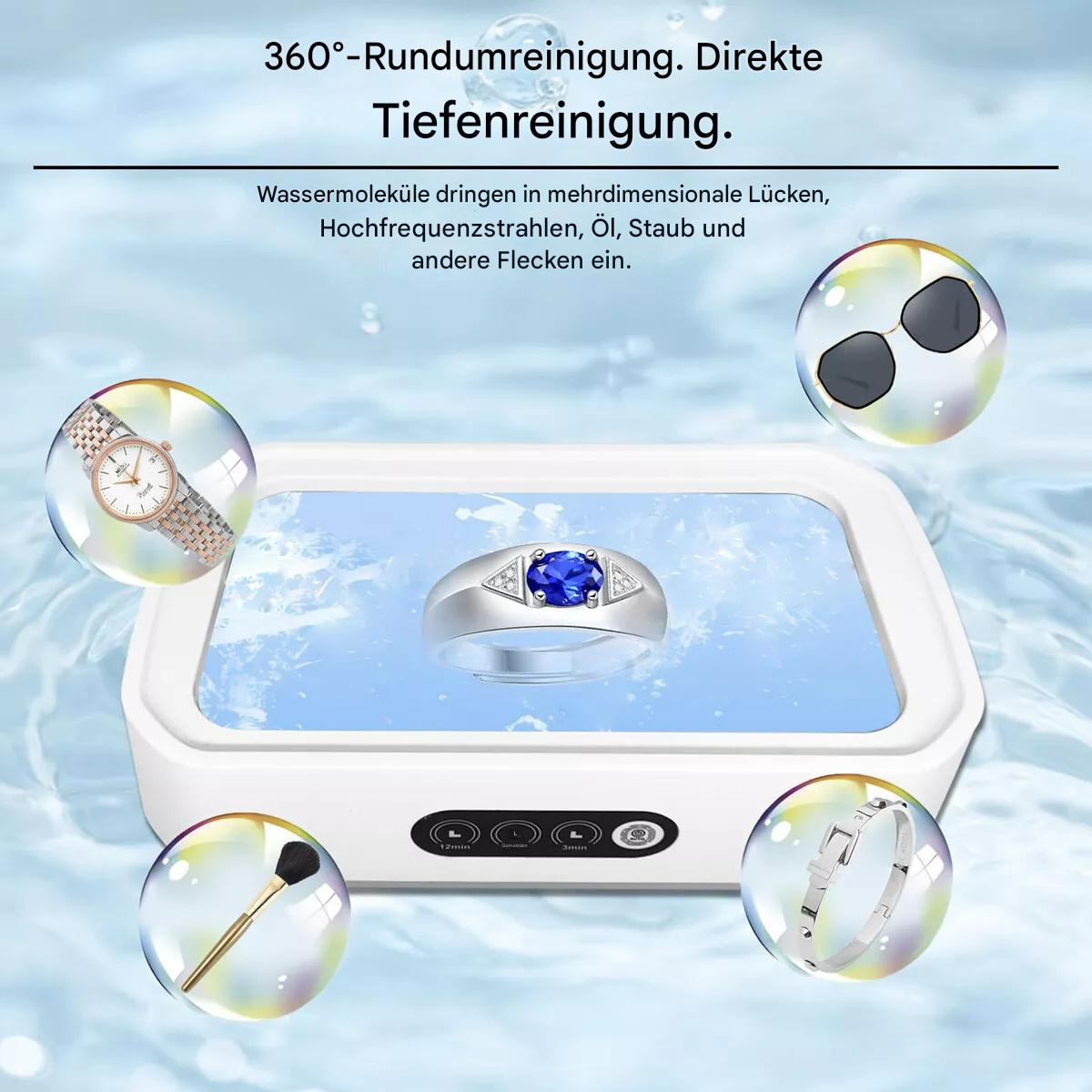Reinigungsgerät mit gereinigten Gegenständen, darunter eine Uhr, ein Ring und eine Sonnenbrille.