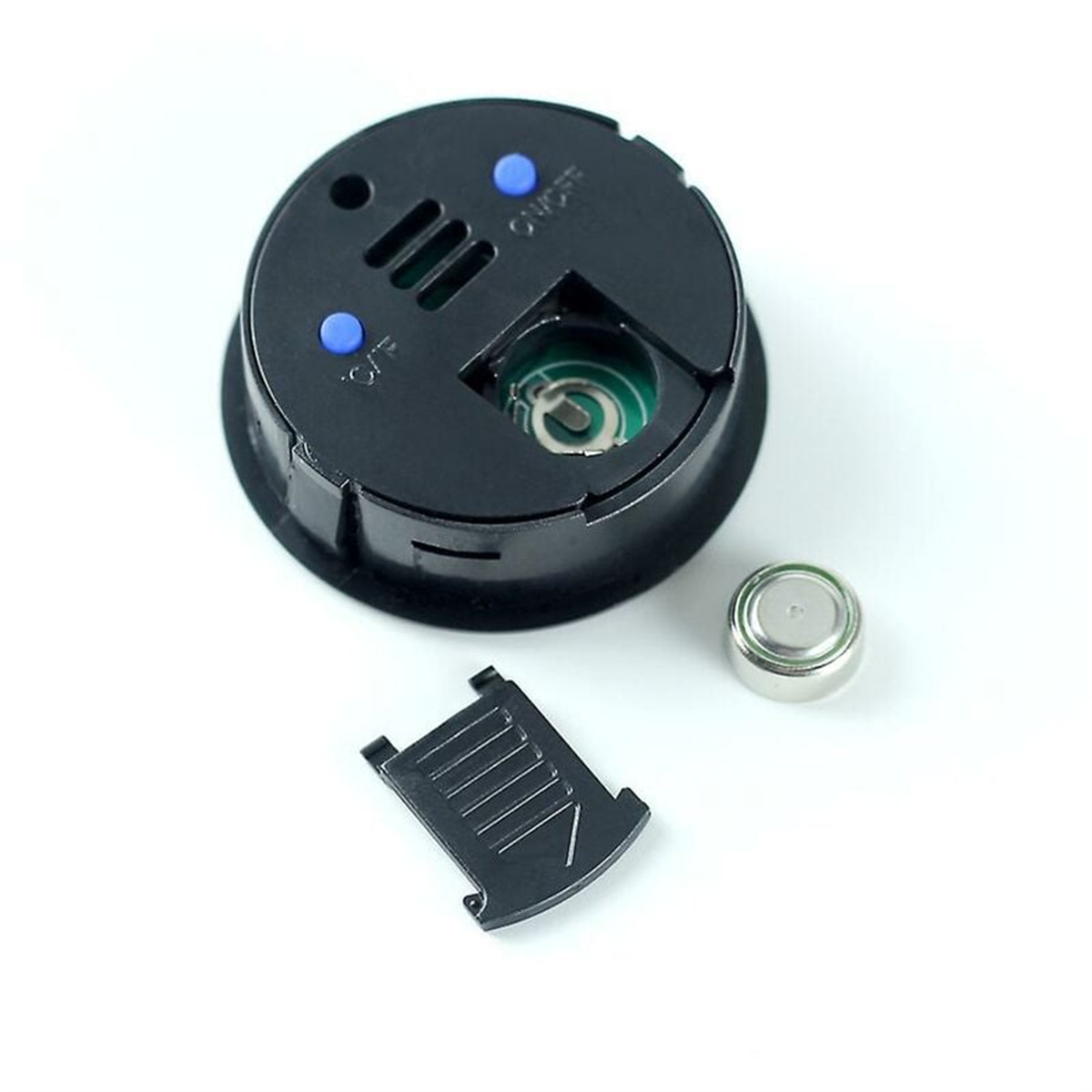 Die Rückseite eines schwarzen Geräts mit Knöpfen, einer Batterie und einem geöffneten Fach.
