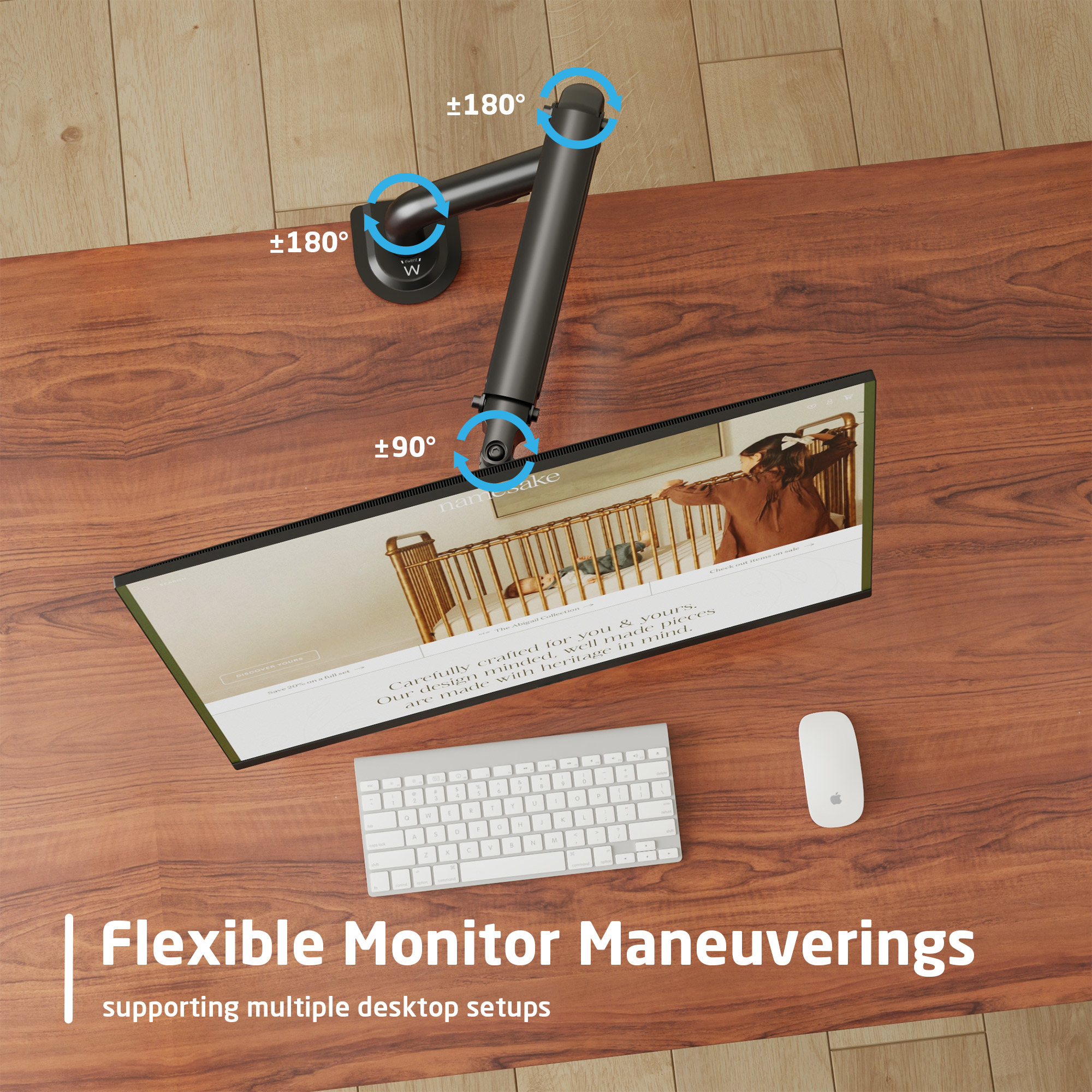 Ein Monitorarm mit Monitor auf einem Holztisch. Auf dem Tisch befinden sich auch eine Tastatur und eine Maus.