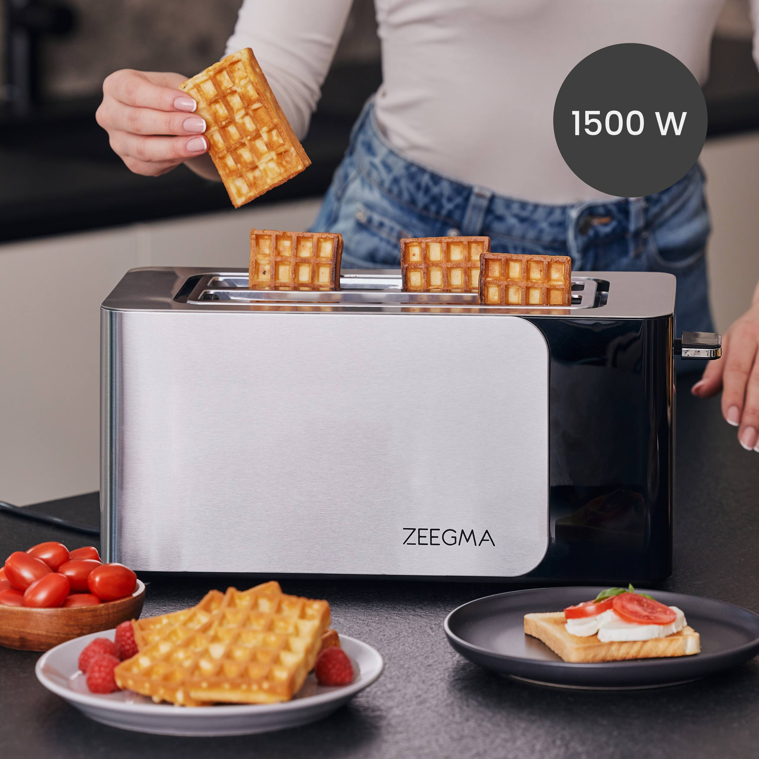 Toster z goframi. Ręka kobiety trzyma gofra. Pokazano także inne gofry i tosty.