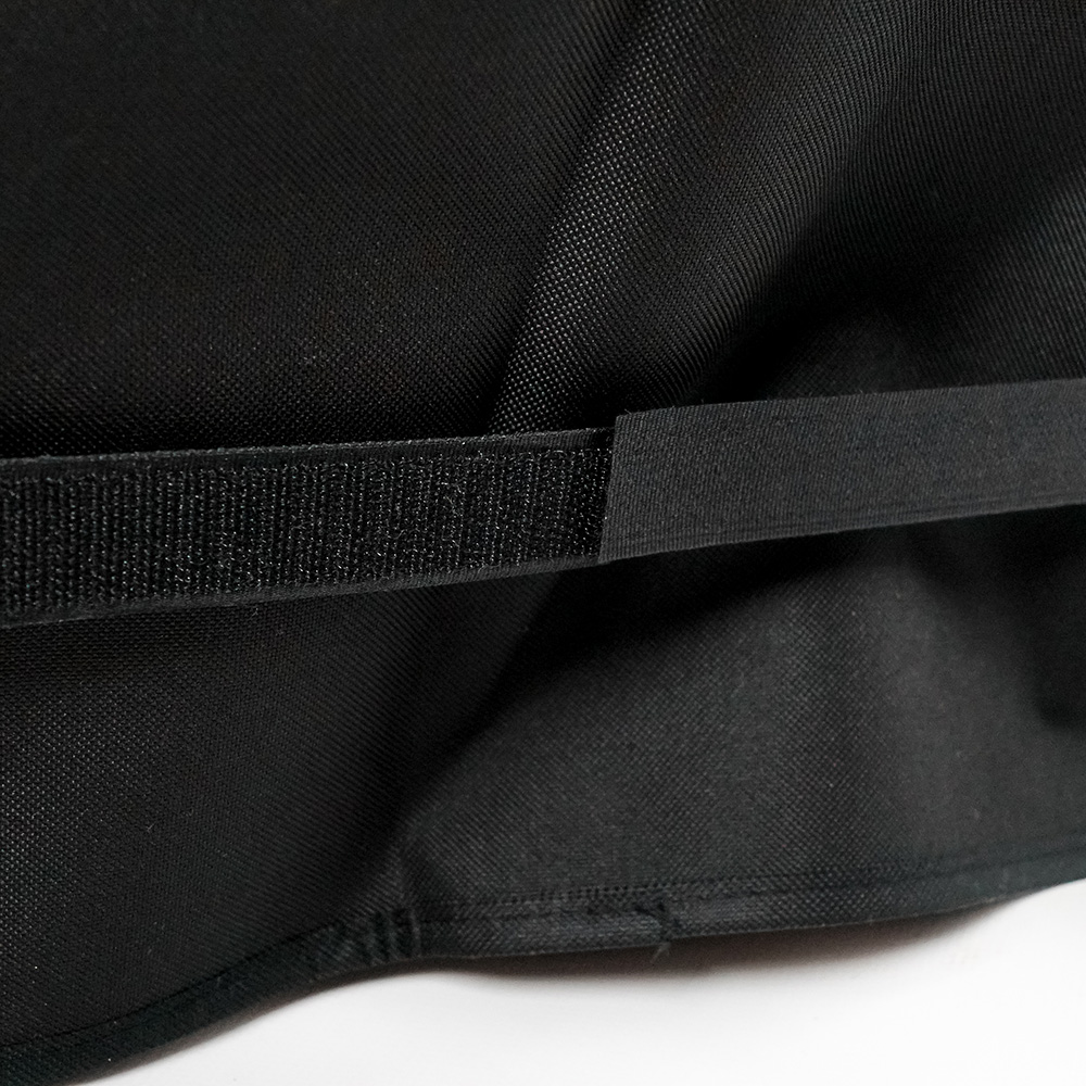 Black Velcro strap on a black background. Close up view.