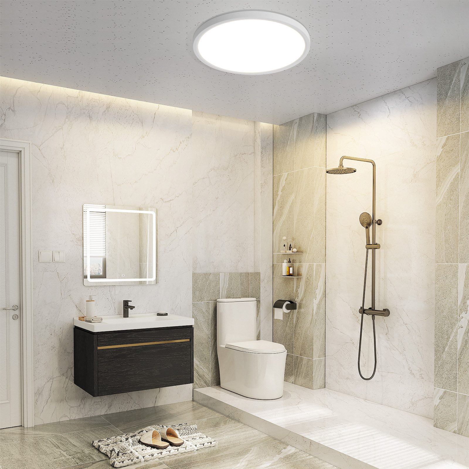 Modernes Badezimmer mit weißer Toilette, Dusche und Waschtisch mit beleuchtetem Spiegel.