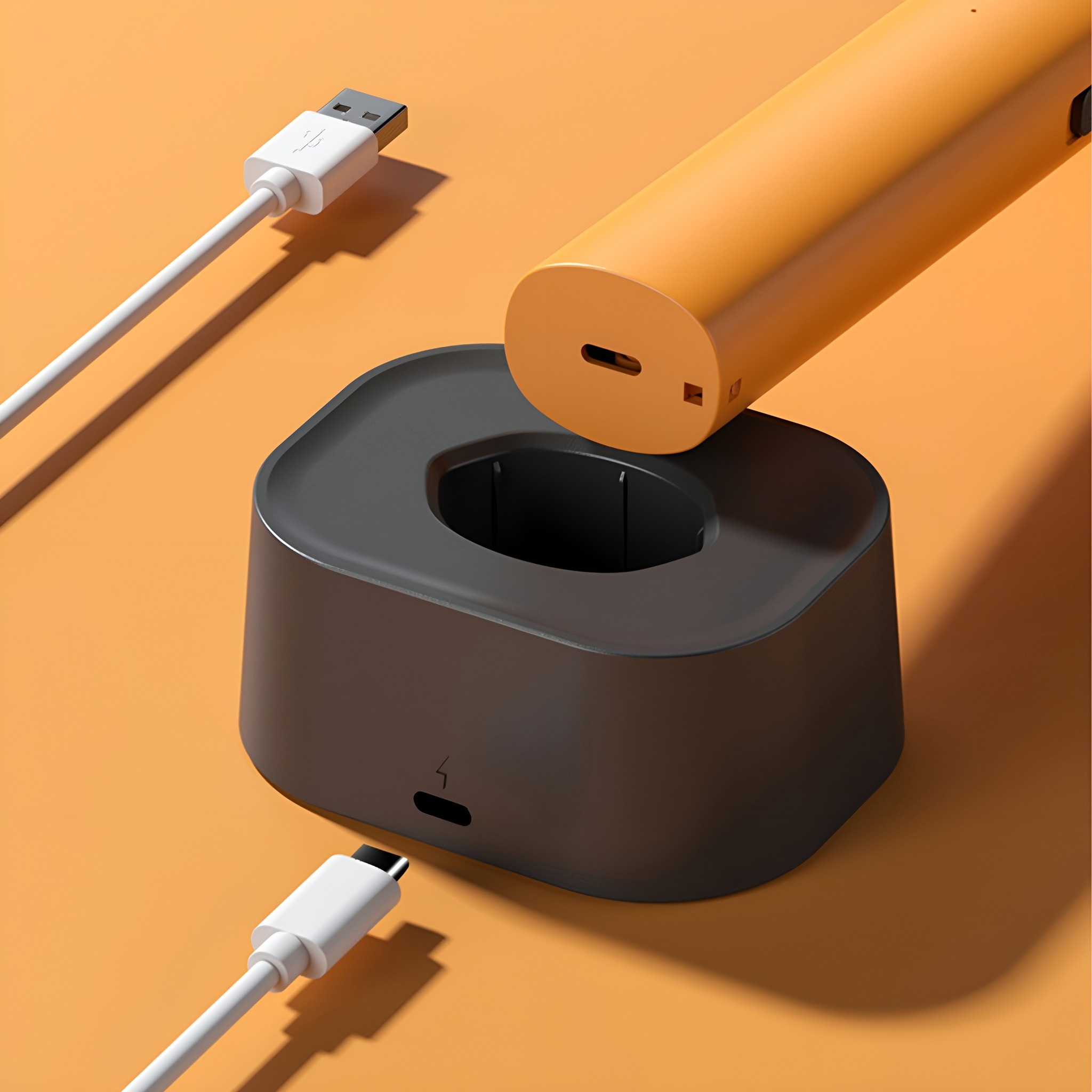 Ladestation mit USB-Kabel und Zahnbürstengriff oben.
