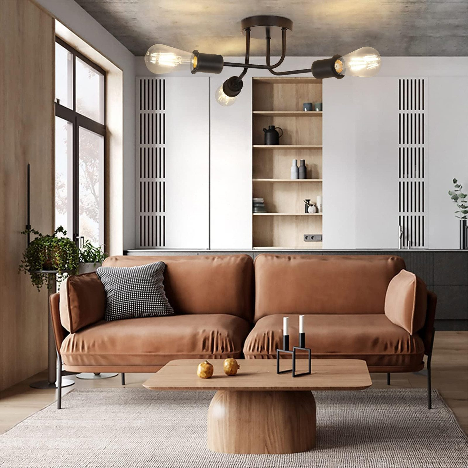 Soggiorno moderno con divano marrone, tavolino e lampade a soffitto.