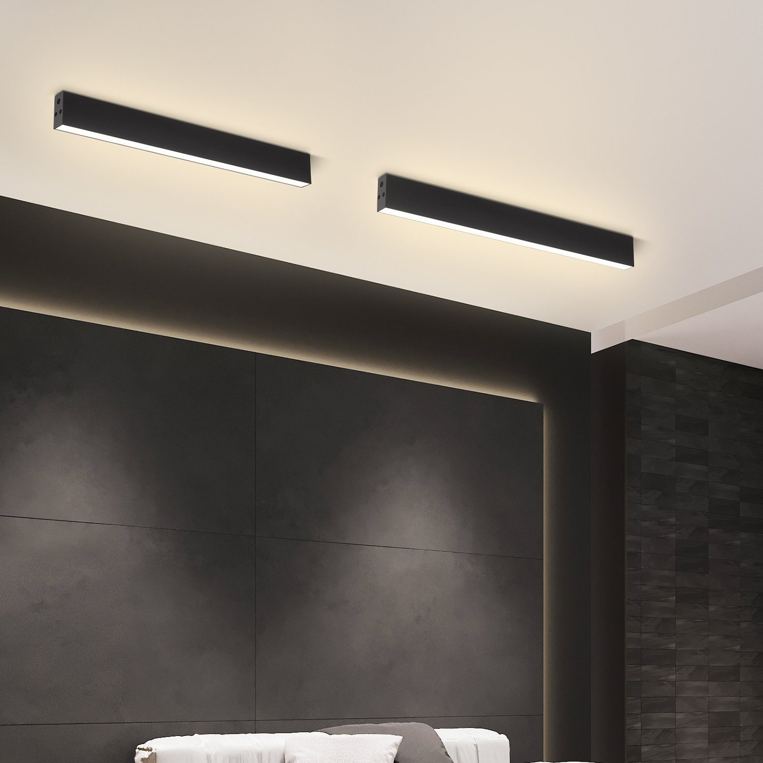 Due luci a LED rettangolari nere montate su un soffitto bianco.