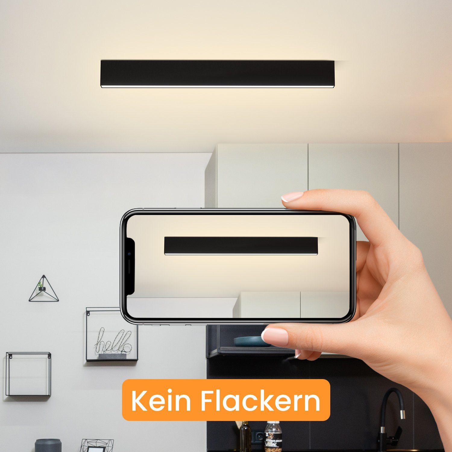 Lampada da soffitto nera tenuta in mano, testo: Kein Flackern.