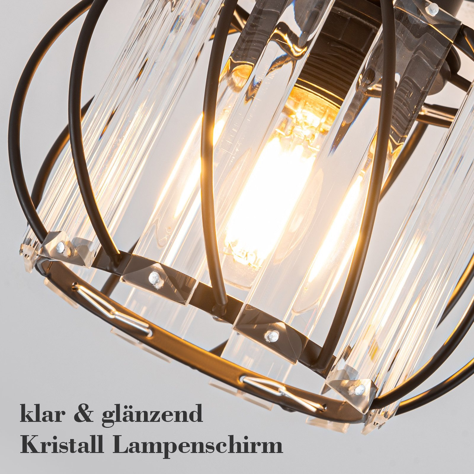 Una plafoniera decorativa con telaio nero e tubi di vetro. Le lampadine sono visibili all'interno.
