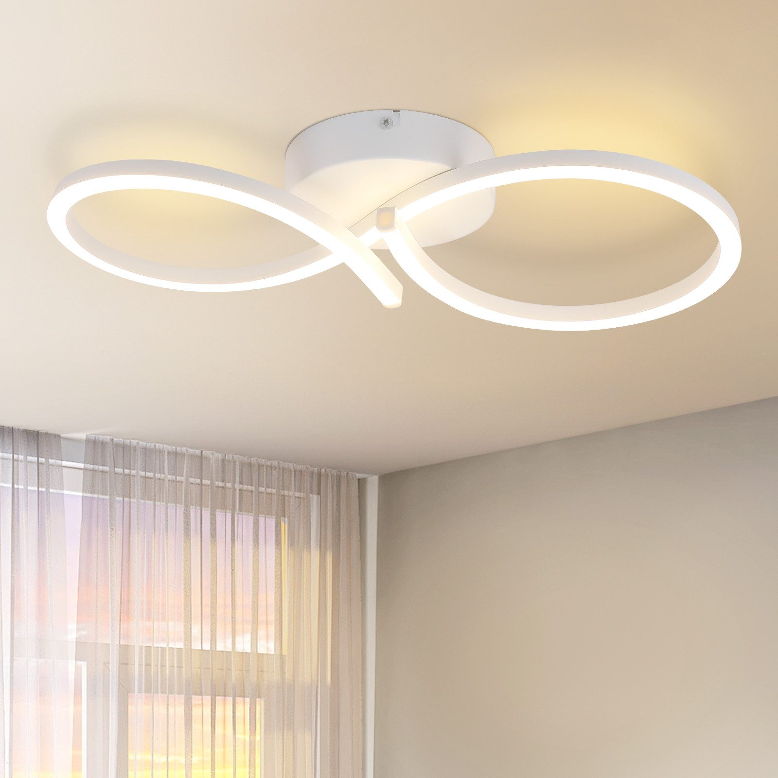 Lampada da soffitto bianca con un design circolare. Lo sfondo è un soffitto bianco.
