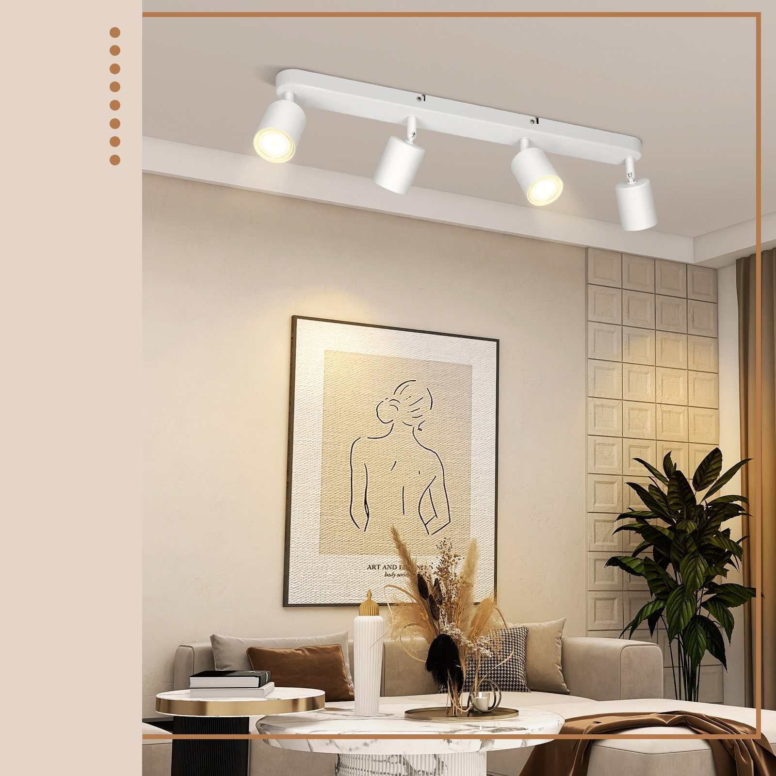 Ein modernes Wohnzimmer mit einer Schienenbeleuchtung und Wandkunst.