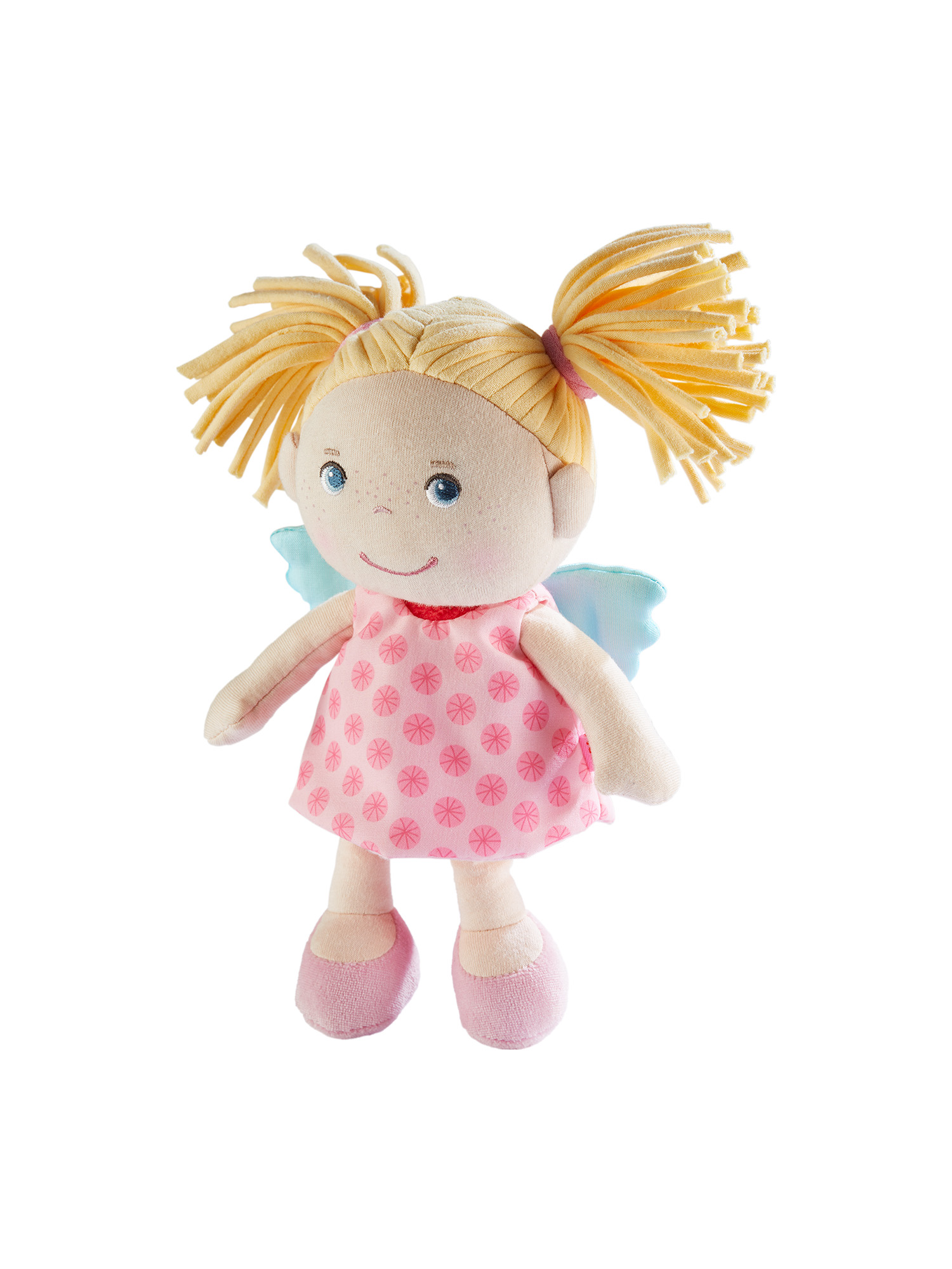 Eine Puppe mit Zöpfen, die ein rosa Kleid mit weißen Punkten und blaue Flügel trägt. Sie hat blondes Haar.