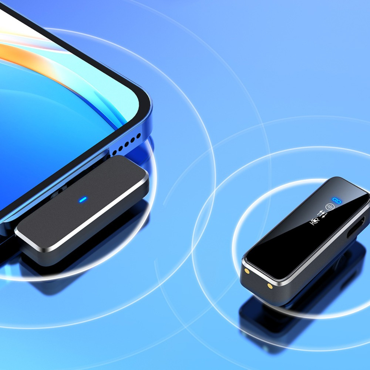 Zwei schwarze drahtlose Mikrofone. Eines ist an ein Telefon angeschlossen, das andere zeigt ein Display.