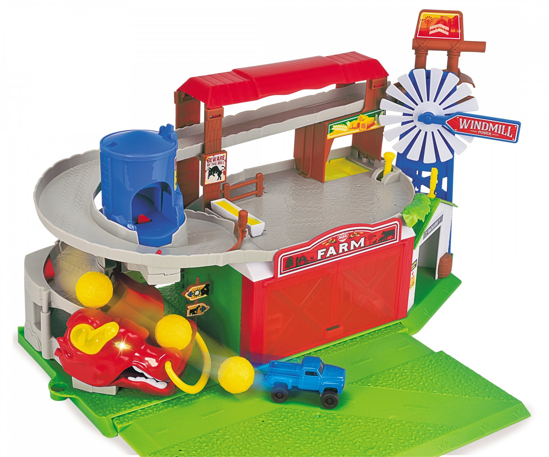 Eine Spielzeug-Bauernhofszene mit roter Scheune, Windmühle und blauem Spielzeug-LKW. Gelbe Bälle fliegen.