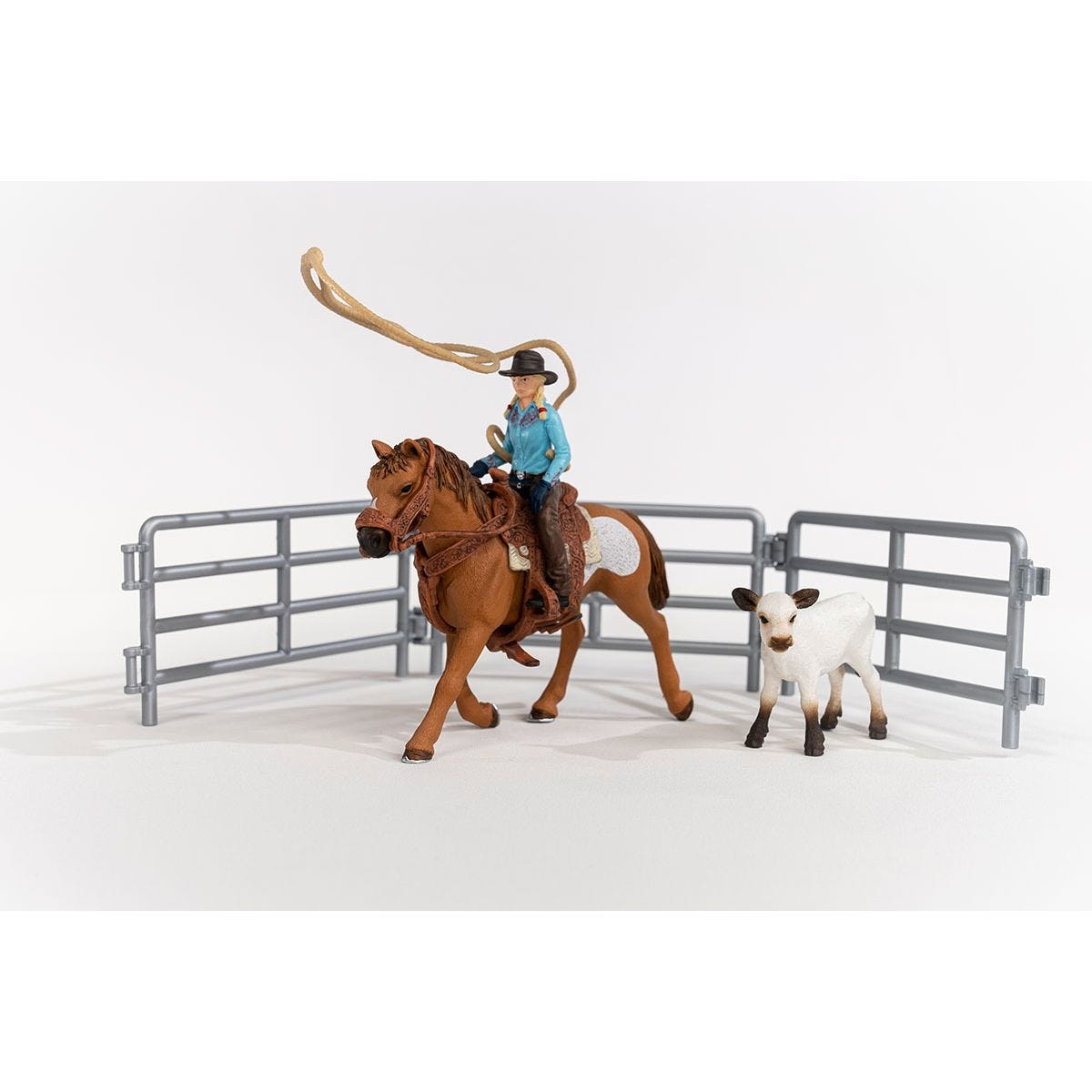 A toy horse and rider with a rope, a calf, and a fence on a white background.