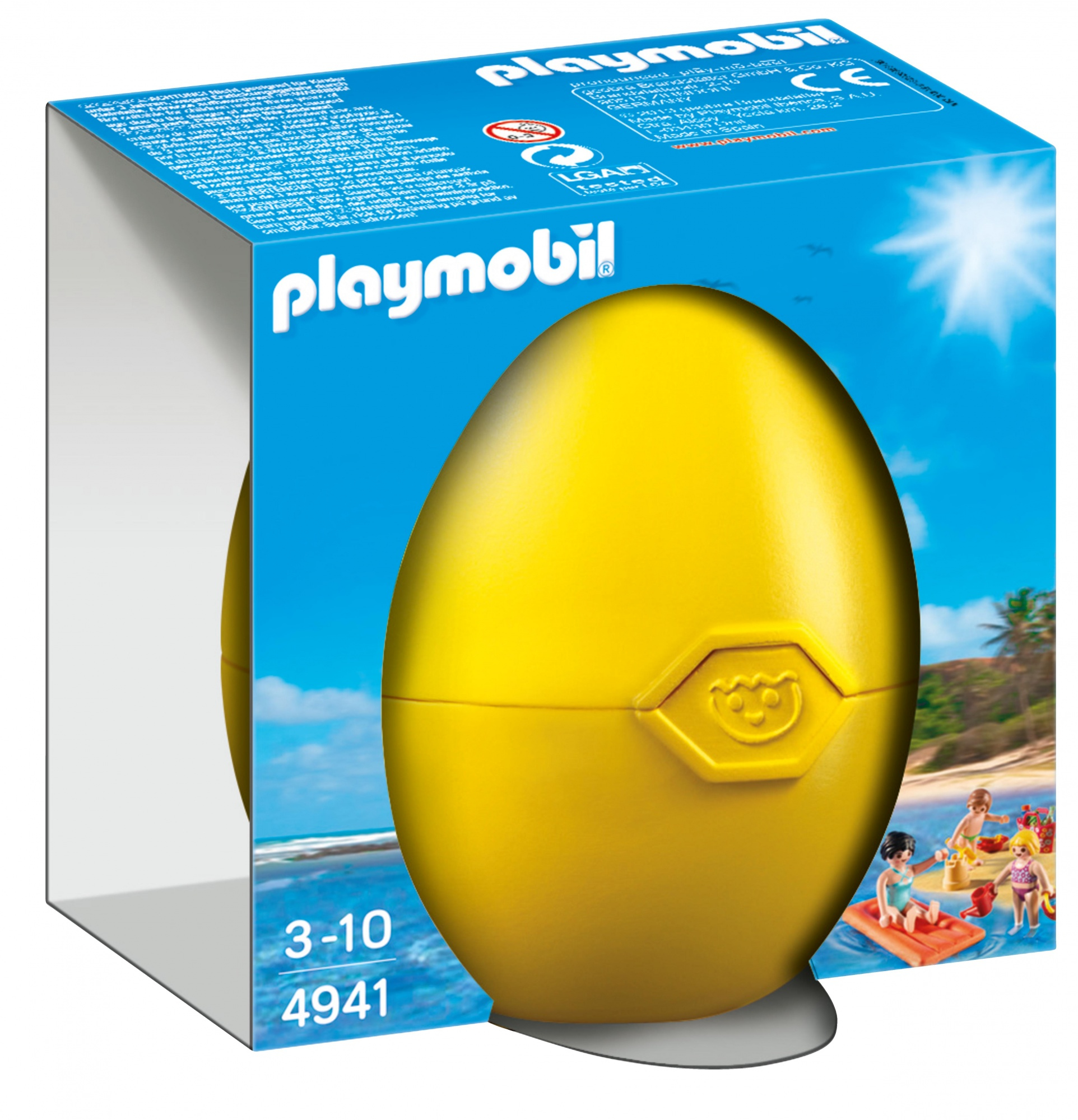 Ein gelbes Plastikei-Spielzeug mit einer Playmobil-Box. Die Szene zeigt Menschen am Strand.