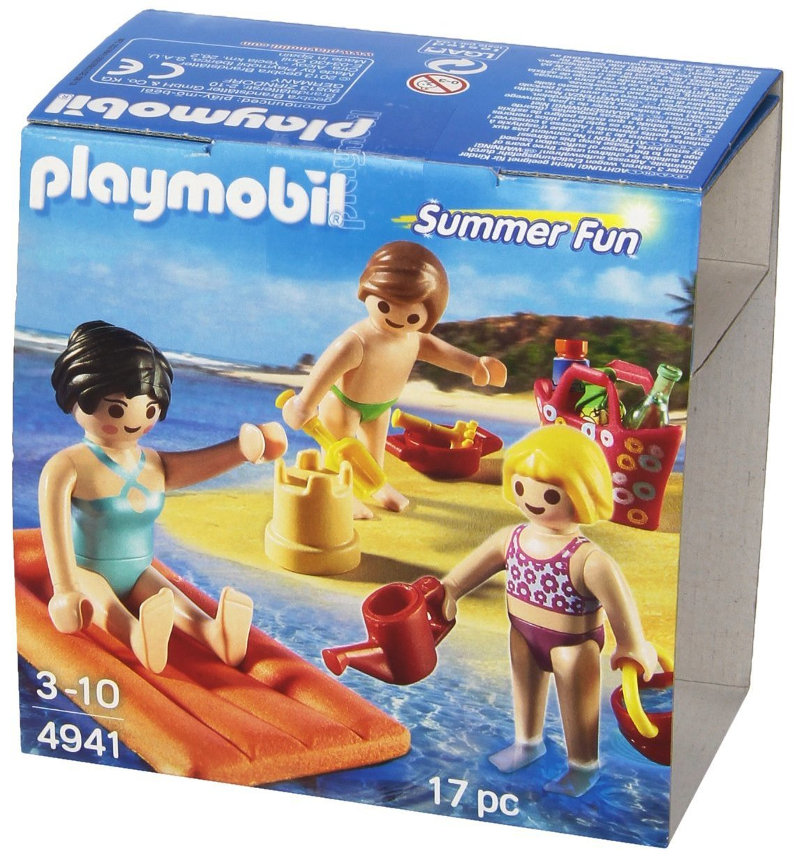 Playmobil Sommer-Fun-Set mit Figuren an einem Strand, mit blauem Himmel und Meer.