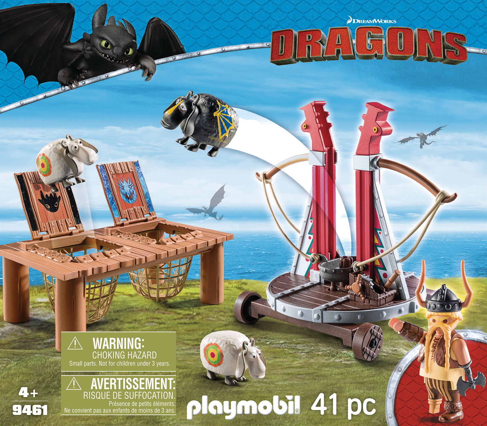 Ein Playmobil-Spielset mit einem Wikinger, einer Katapult und Schafzielen, in einer Außenumgebung.