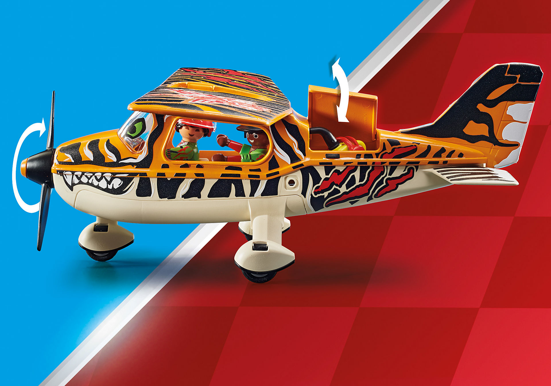 Ein Spielzeugflugzeug mit Tigerstreifen. Zwei Figuren sitzen darin. Der Hintergrund ist rot und blau.