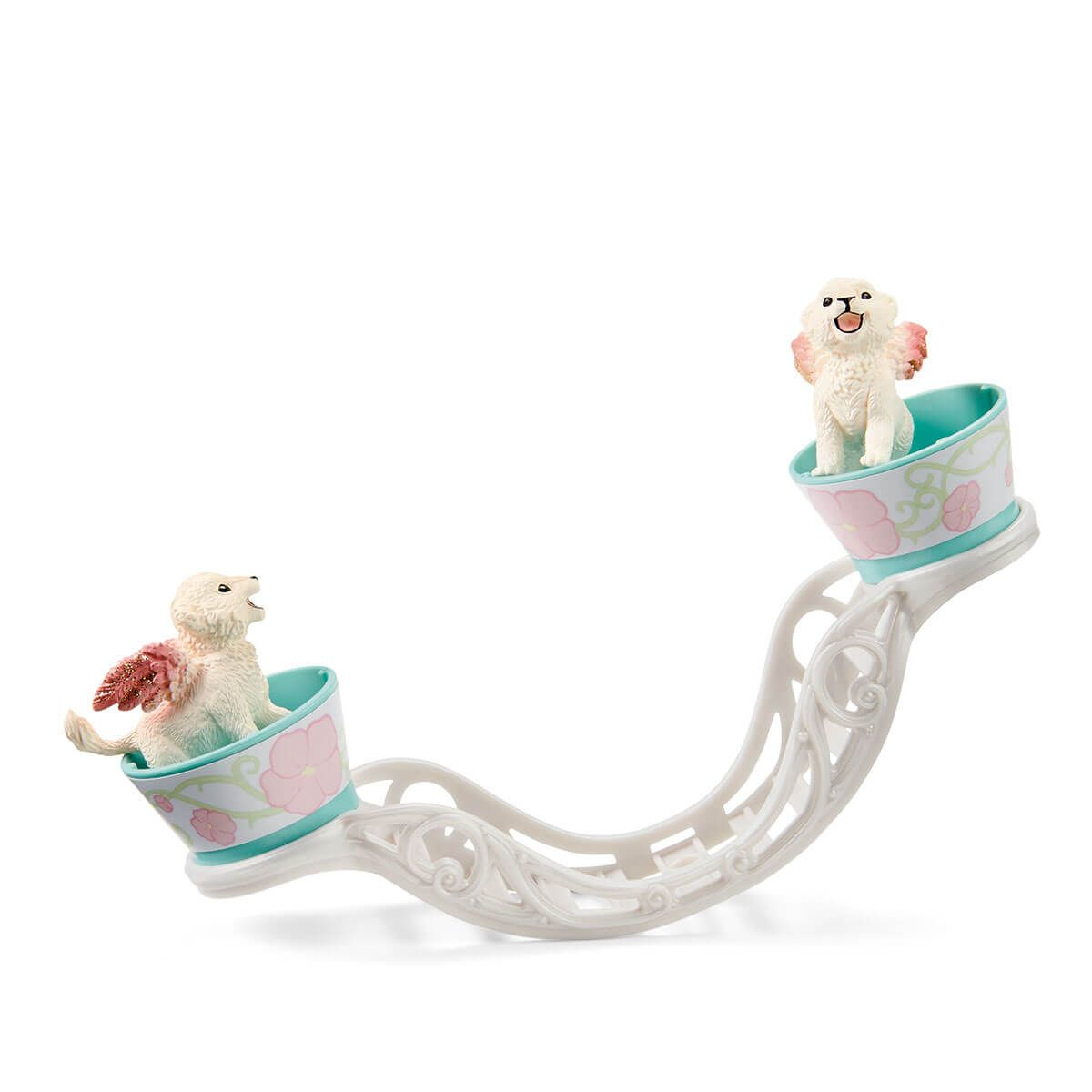Due cani giocattolo con ali d'angelo su una pista bianca curva con accenti rosa e blu.