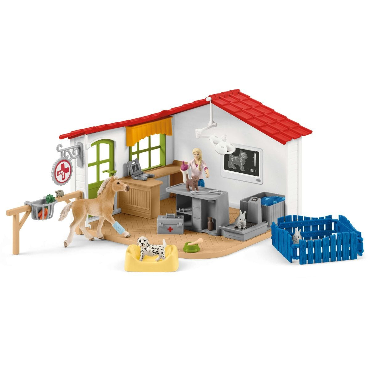 A toy vet clinic with figures, animals, and medical equipment.